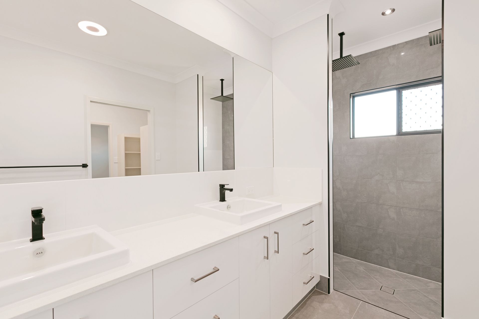 Modern Bathroom With White Double Vanity — Ashlee Jones Homes in Gordonvale, QLD