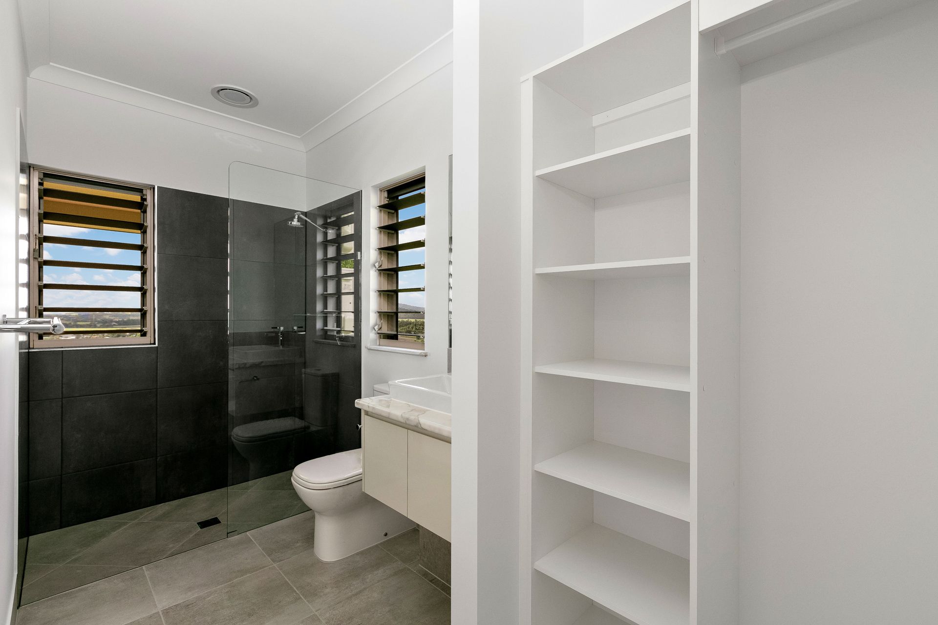 Modern Bathroom With a Tiled Walk-in Shower — Ashlee Jones Homes in Gordonvale, QLD