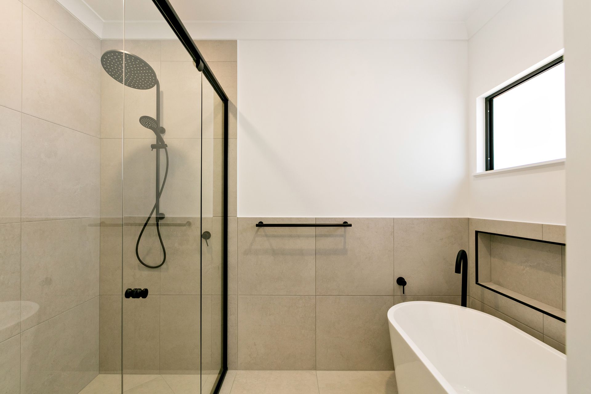 Modern Bathroom With a Glass-enclosed Shower — Ashlee Jones Homes in Gordonvale, QLD