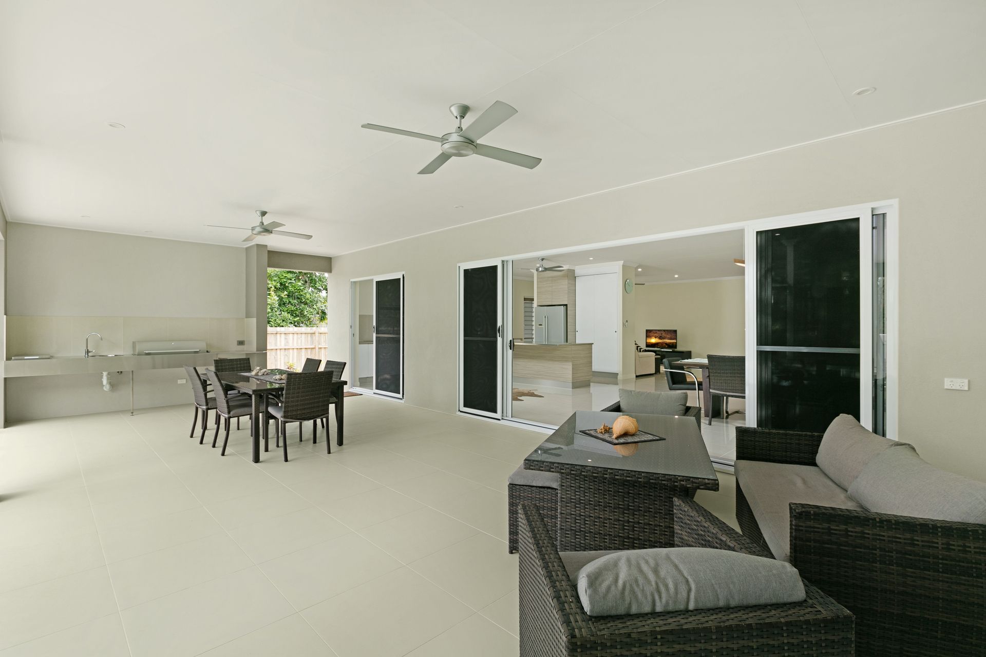 A Bright, Spacious Outdoor Patio Featuring a Dining Set — Ashlee Jones Homes in Gordonvale, QLD
