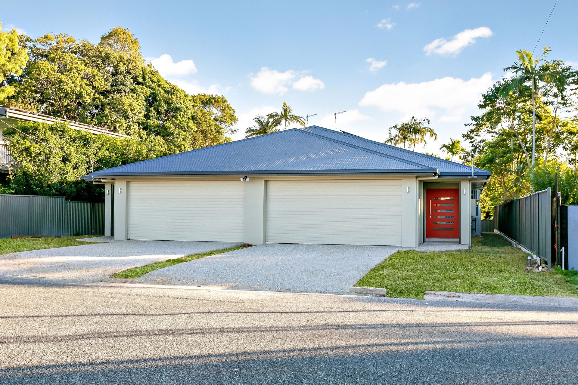 Single-story House With a Blue Hip Roof, Beige Exterior — Ashlee Jones Homes in Gordonvale, QLD
