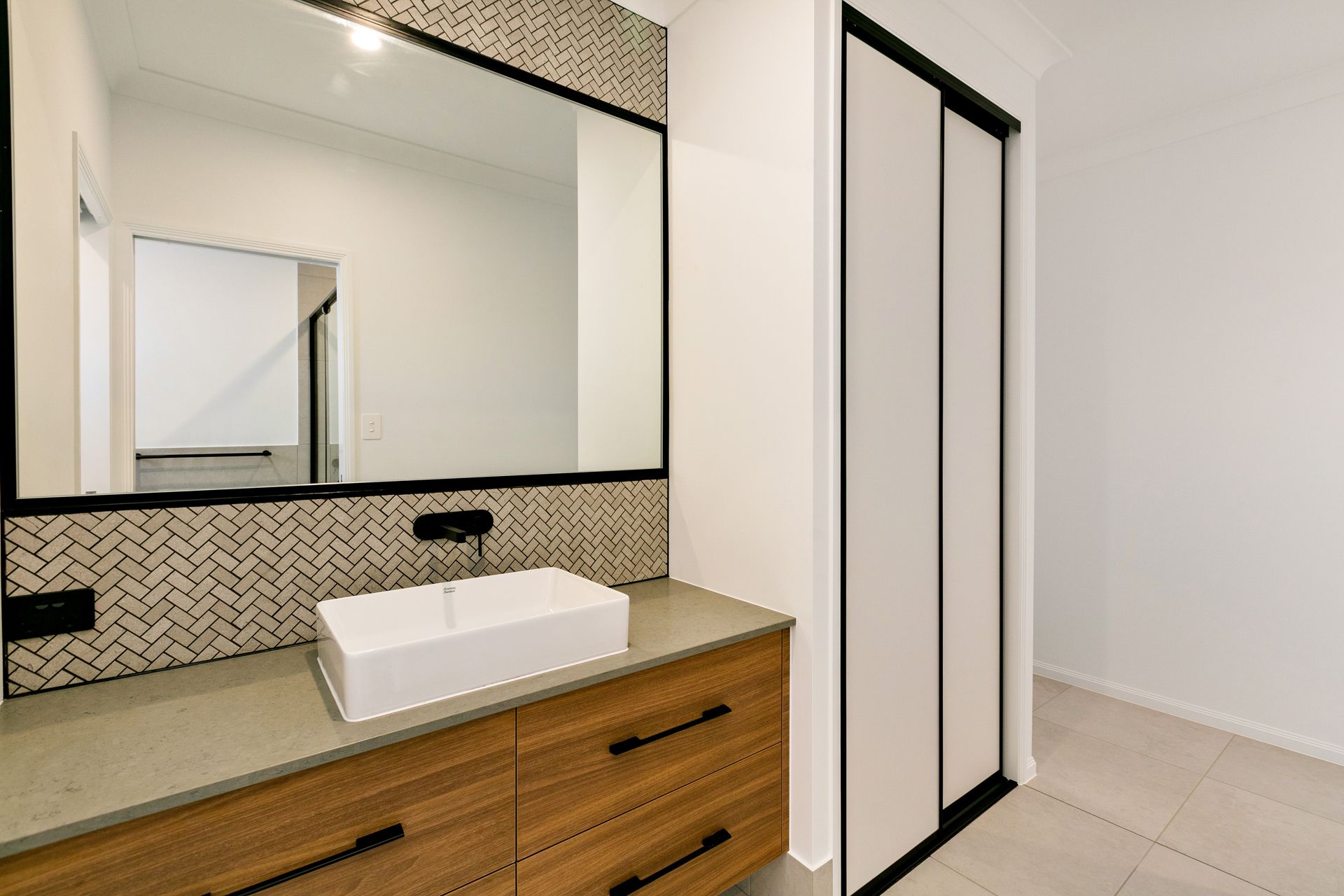 Modern Bathroom Vanity With a White Vessel Sink — Ashlee Jones Homes in Gordonvale, QLD