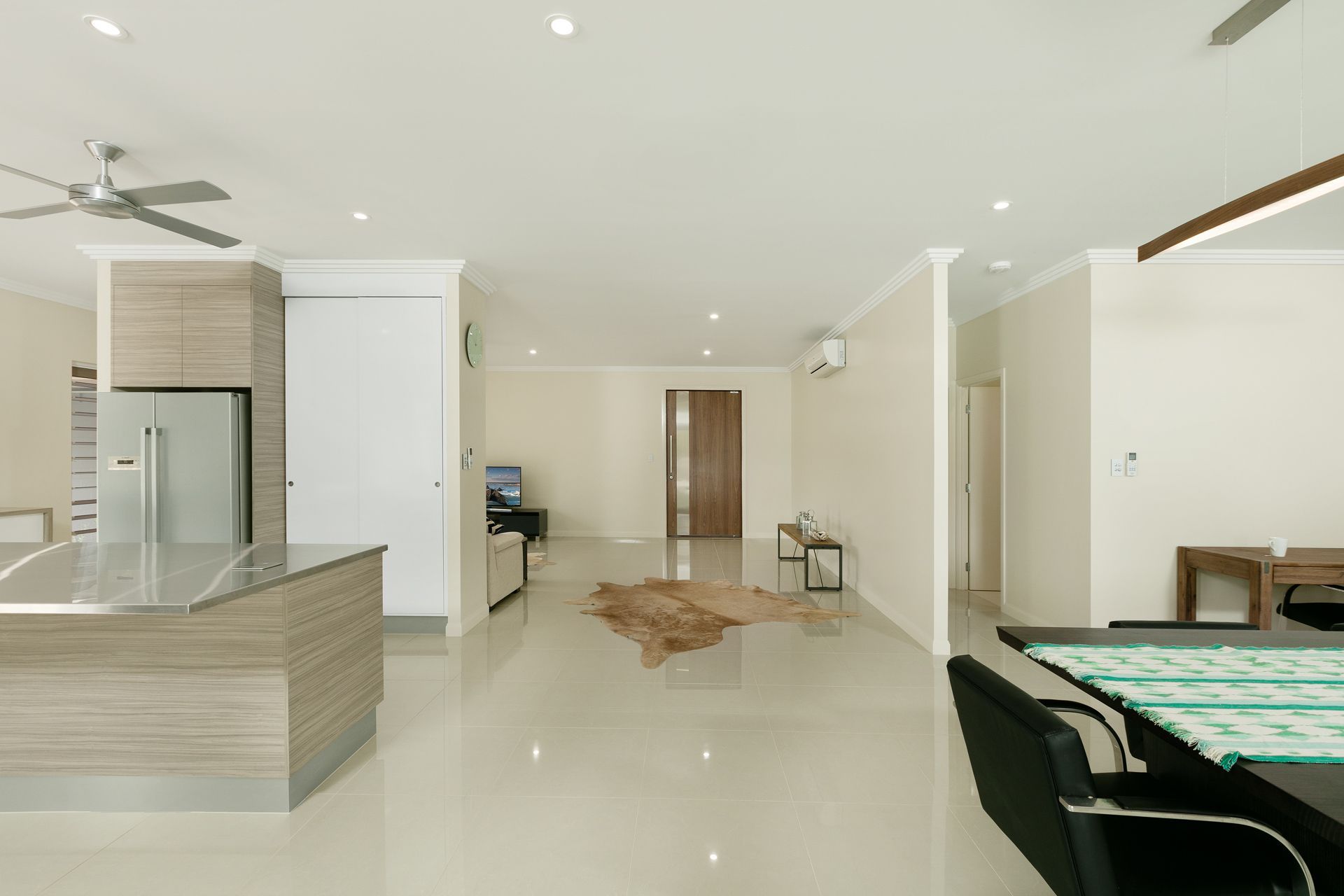 A Spacious, Modern Open-plan Home Featuring a Kitchen Island — Ashlee Jones Homes in Gordonvale, QLD