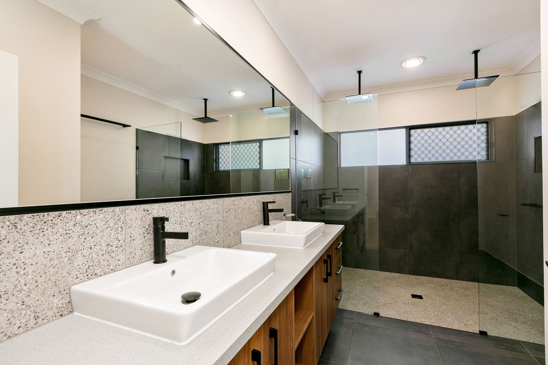 A Modern Double-sink Bathroom Vanity With Black Fixtures — Ashlee Jones Homes in Gordonvale, QLD
