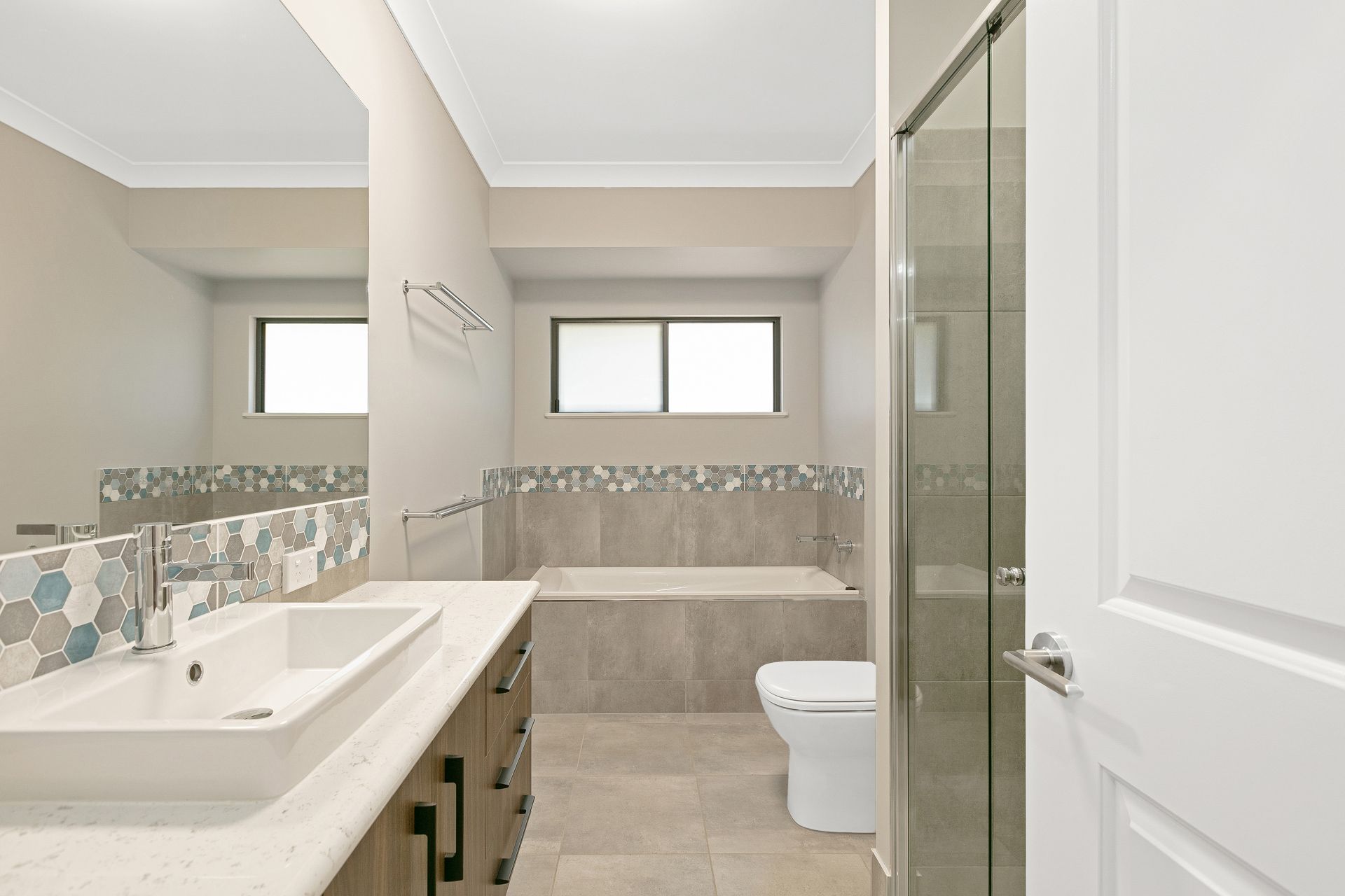 Modern Bathroom With a White Vessel Sink, Vanity — Ashlee Jones Homes in Gordonvale, QLD