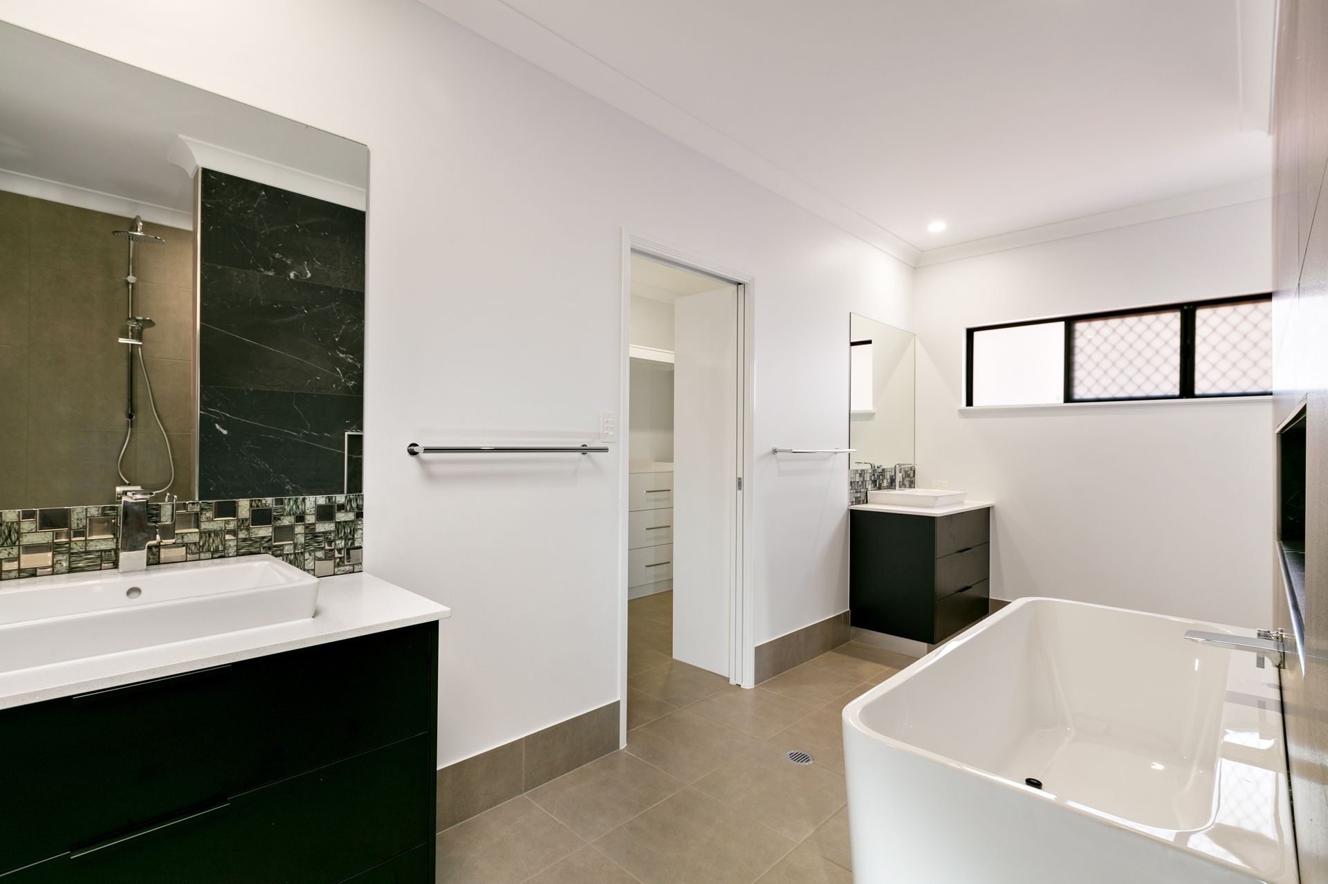 Modern Bathroom With White Walls — Ashlee Jones Homes in Gordonvale, QLD