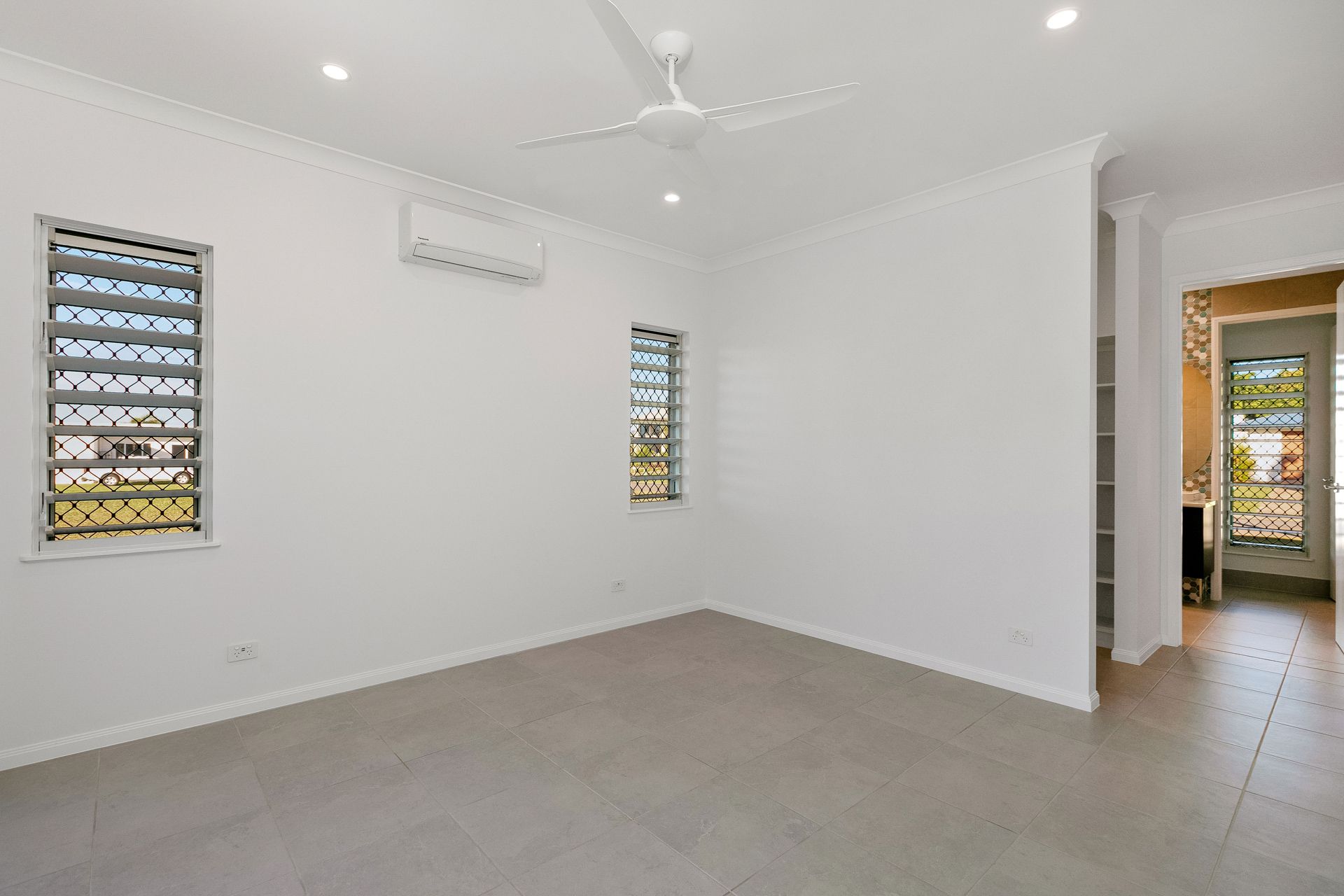 A Bright, Empty Room With White Walls — Ashlee Jones Homes in Gordonvale, QLD