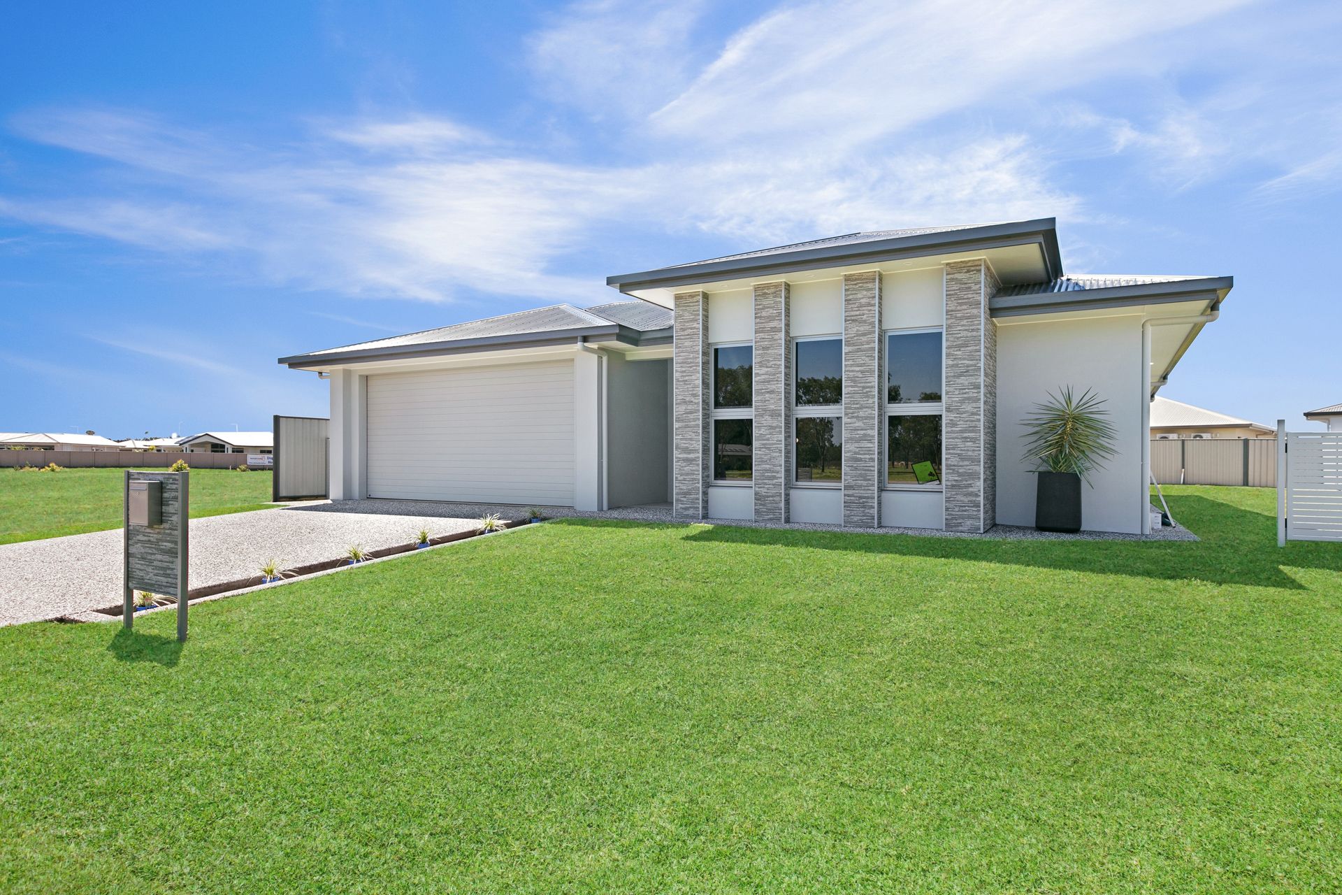 A Modern, Light-colored Single-story House — Ashlee Jones Homes in Gordonvale, QLD
