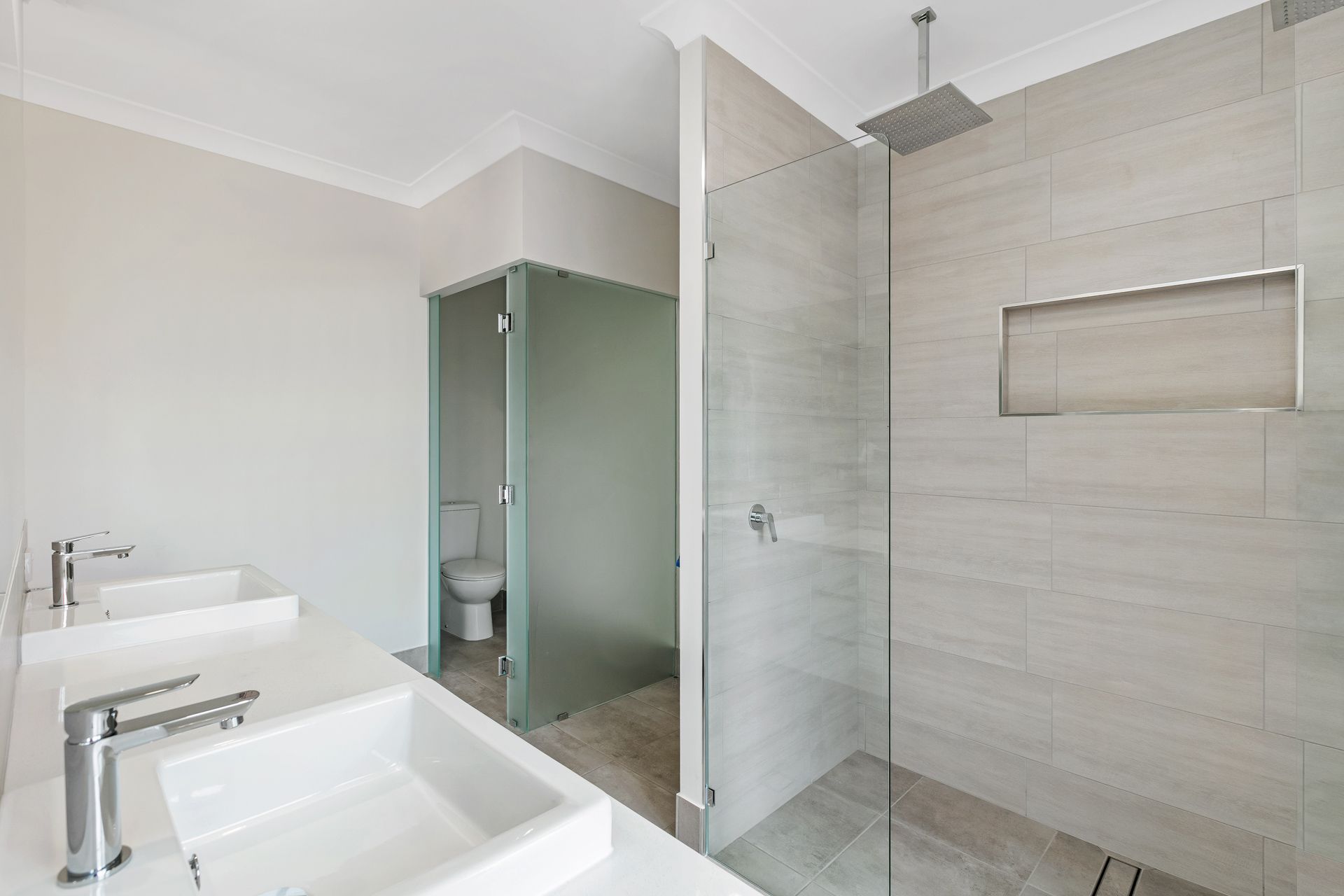 A Modern Bathroom Featuring a Double Vanity — Ashlee Jones Homes in Gordonvale, QLD