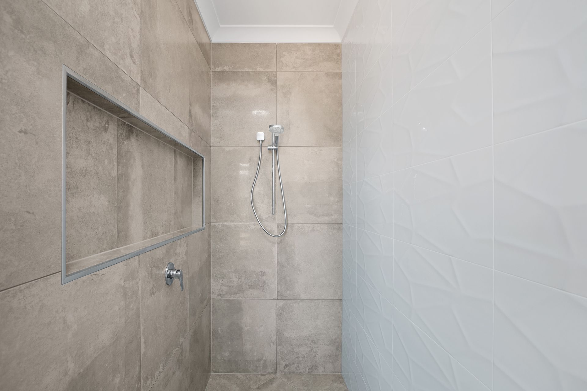 Modern Walk-in Shower With Gray Tiled Walls — Ashlee Jones Homes in Gordonvale, QLD