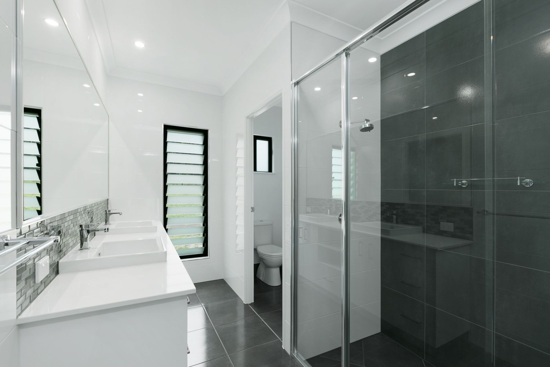Modern Bathroom With a Double Vanity, a Glass Shower — Ashlee Jones Homes in Gordonvale, QLD