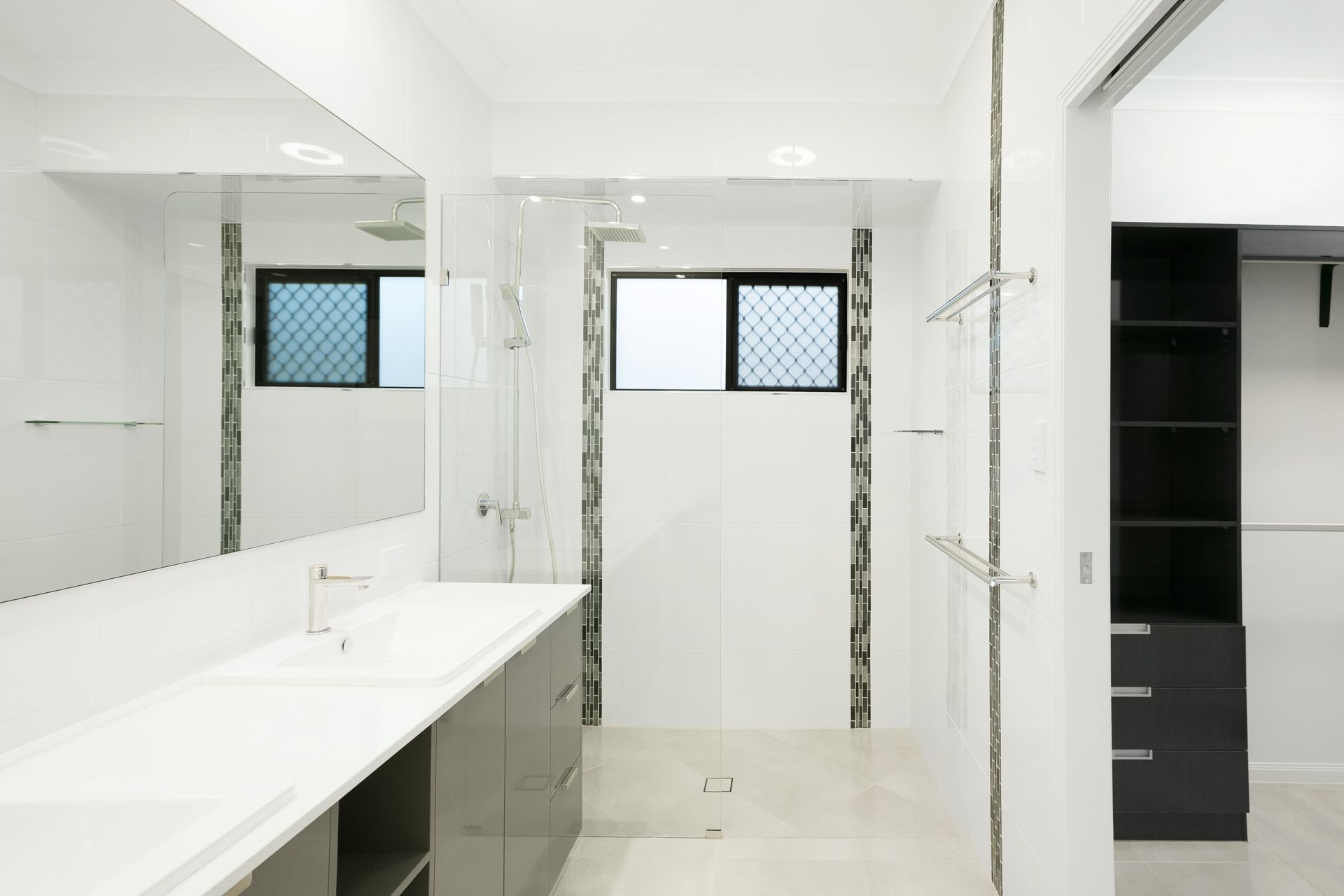 Modern Bathroom With a Double Sink Vanity, a Glass-enclosed Shower — Ashlee Jones Homes in Gordonvale, QLD