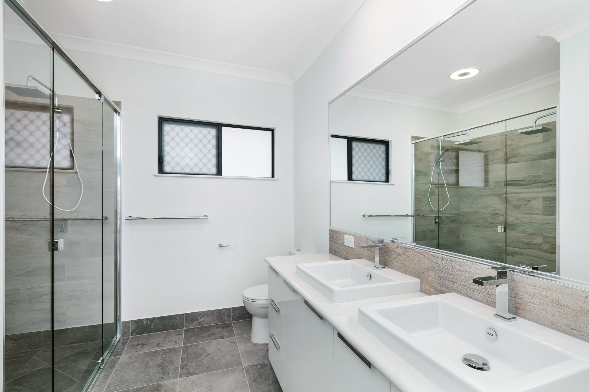 Modern Bathroom Featuring a Double Vanity — Ashlee Jones Homes in Gordonvale, QLD