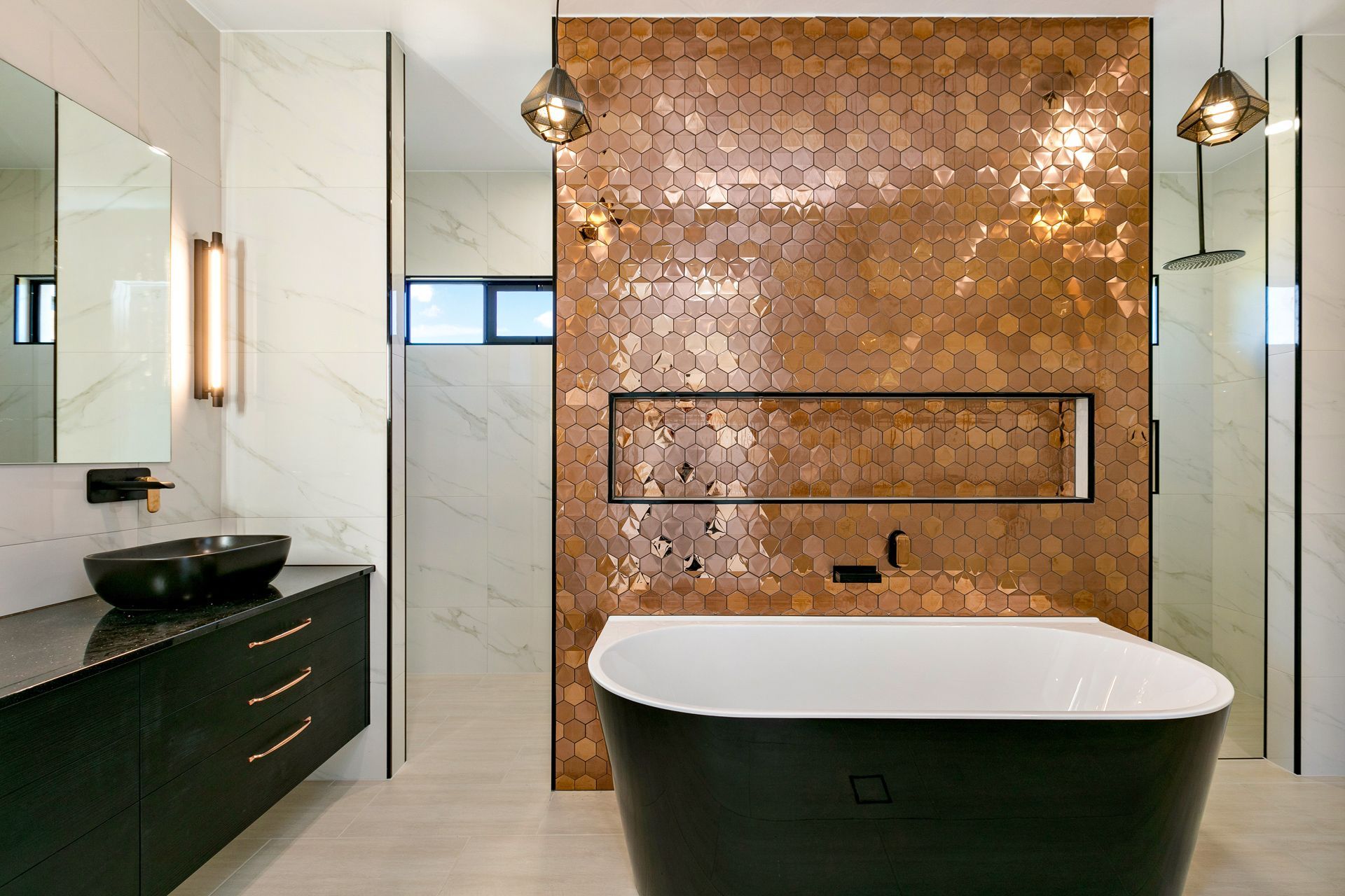 A Luxurious Bathroom Featuring a Black Soaking Tub — Ashlee Jones Homes in Gordonvale, QLD