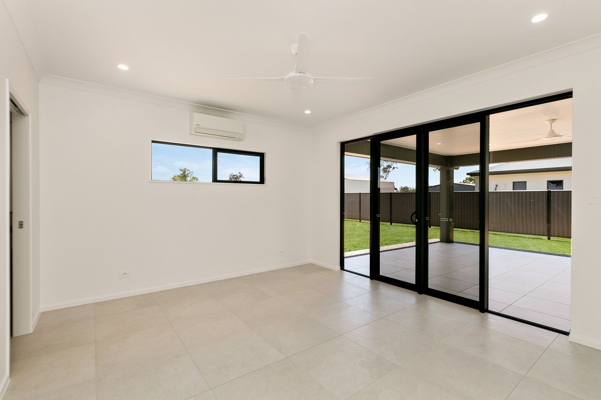 Empty Room With Light-colored Tile Floors — Ashlee Jones Homes in Gordonvale, QLD
