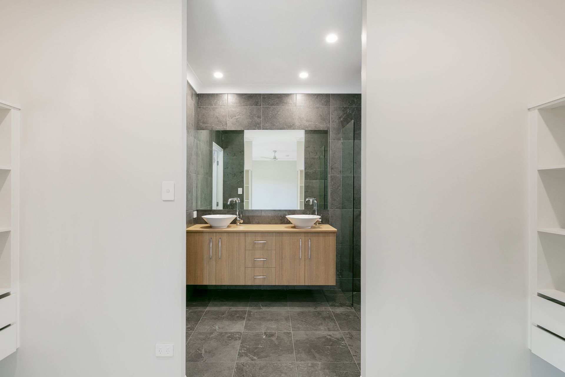 A Modern Bathroom Featuring a Double Vanity — Ashlee Jones Homes in Gordonvale, QLD