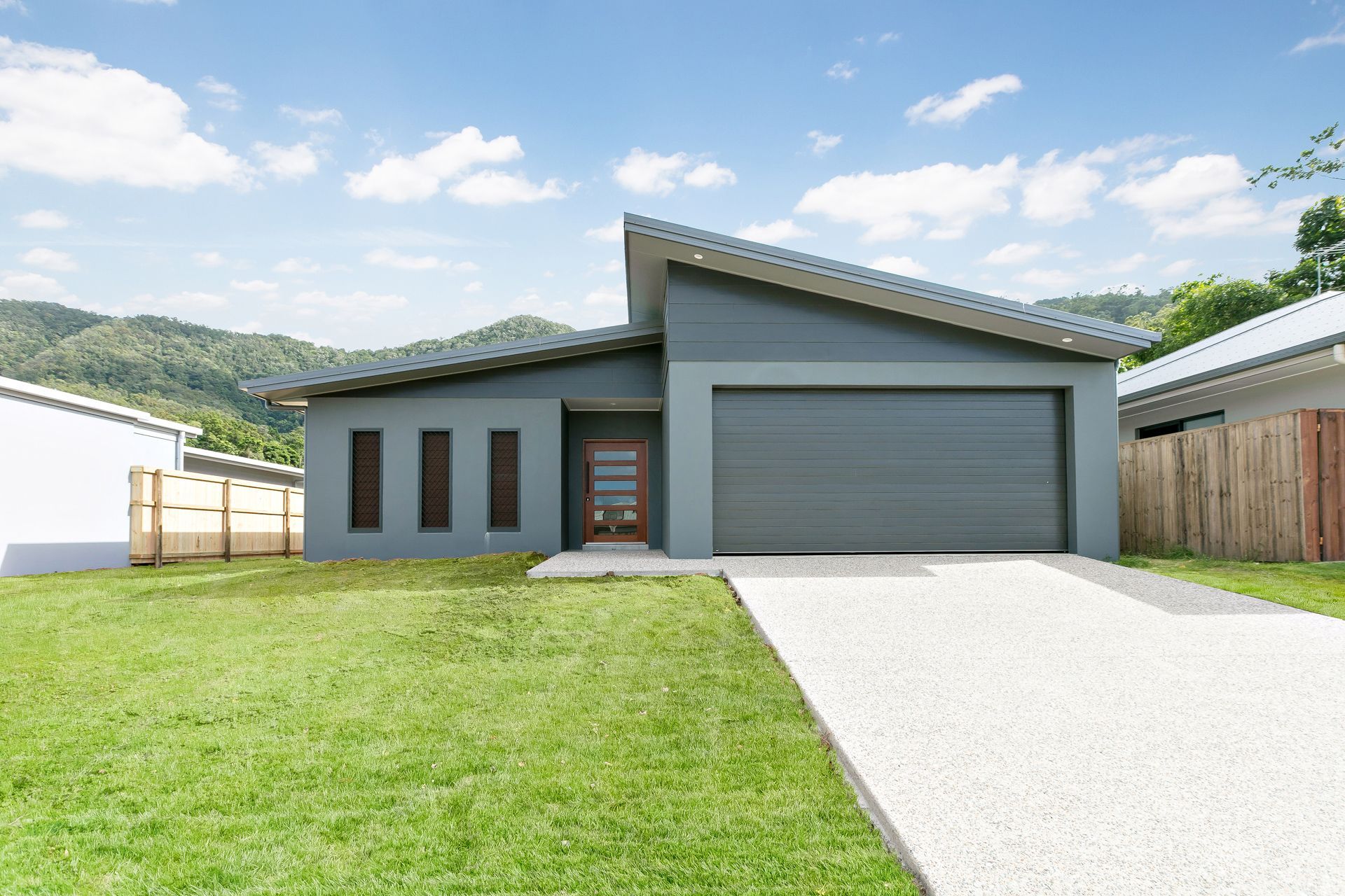 A Single-story Gray House With a Modern Shed Roof — Ashlee Jones Homes in Gordonvale, QLD