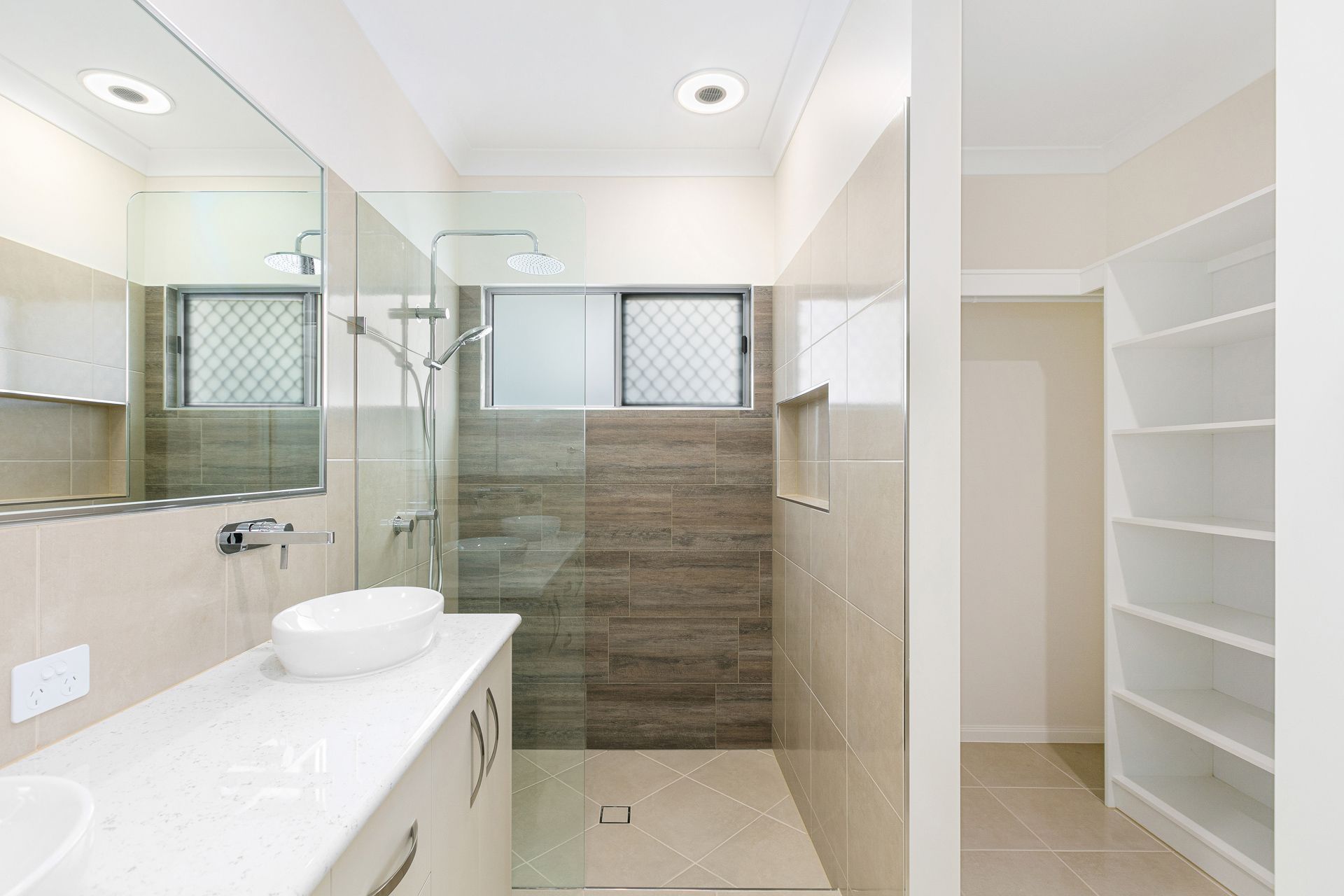 Modern Bathroom With White Vanity, Sink, Glass-enclosed Shower — Ashlee Jones Homes in Gordonvale, QLD