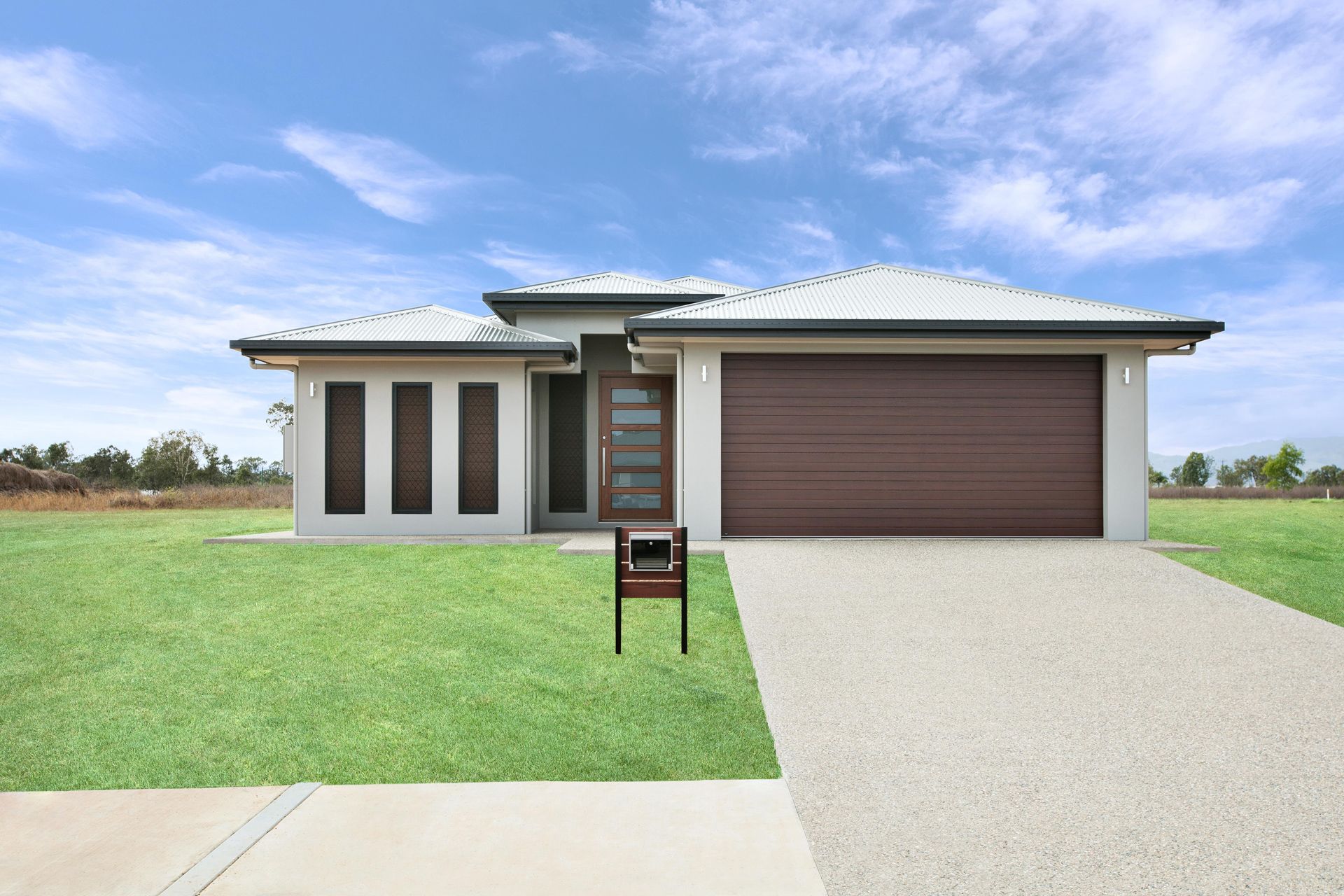 A Modern, Single-story House With a White Exterior — Ashlee Jones Homes in Gordonvale, QLD