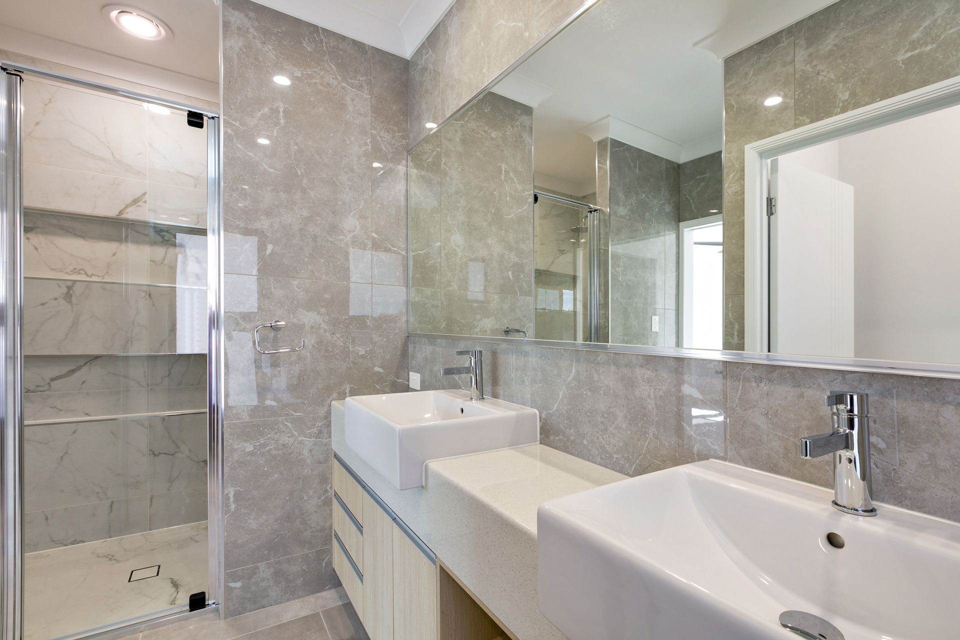 A Bright Modern Bathroom Featuring a Double Vanity — Ashlee Jones Homes in Gordonvale, QLD