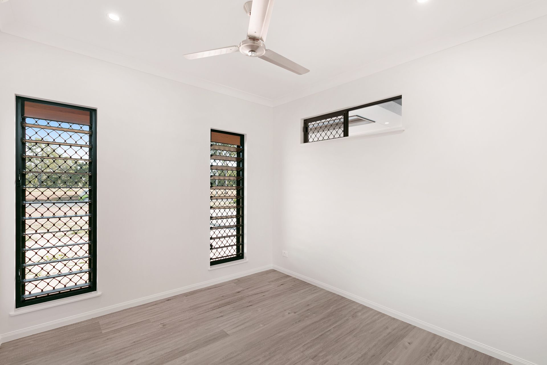 An Empty Room With White Walls — Ashlee Jones Homes in Gordonvale, QLD