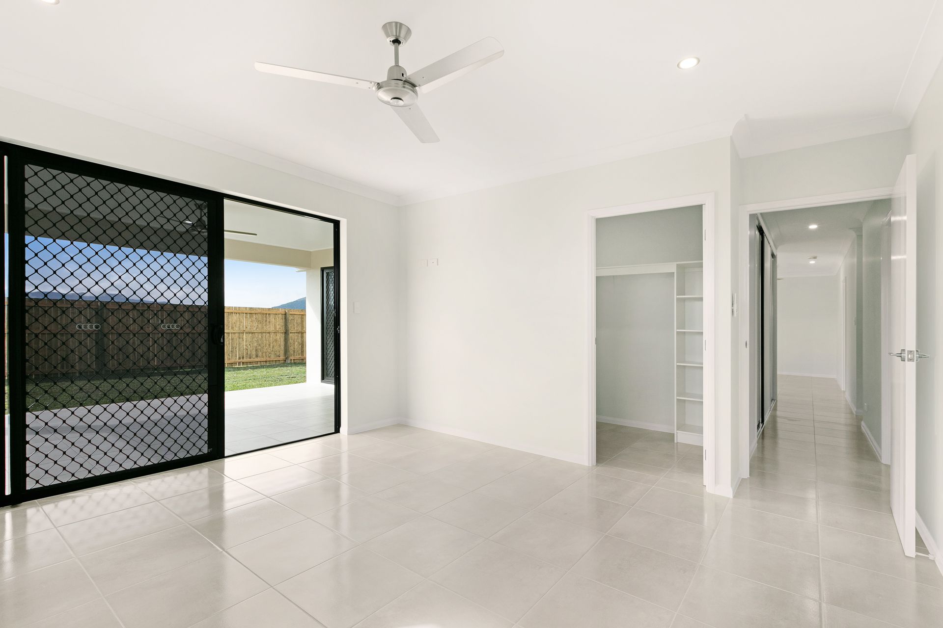 A Bright, Modern Empty Room With White Walls — Ashlee Jones Homes in Gordonvale, QLD