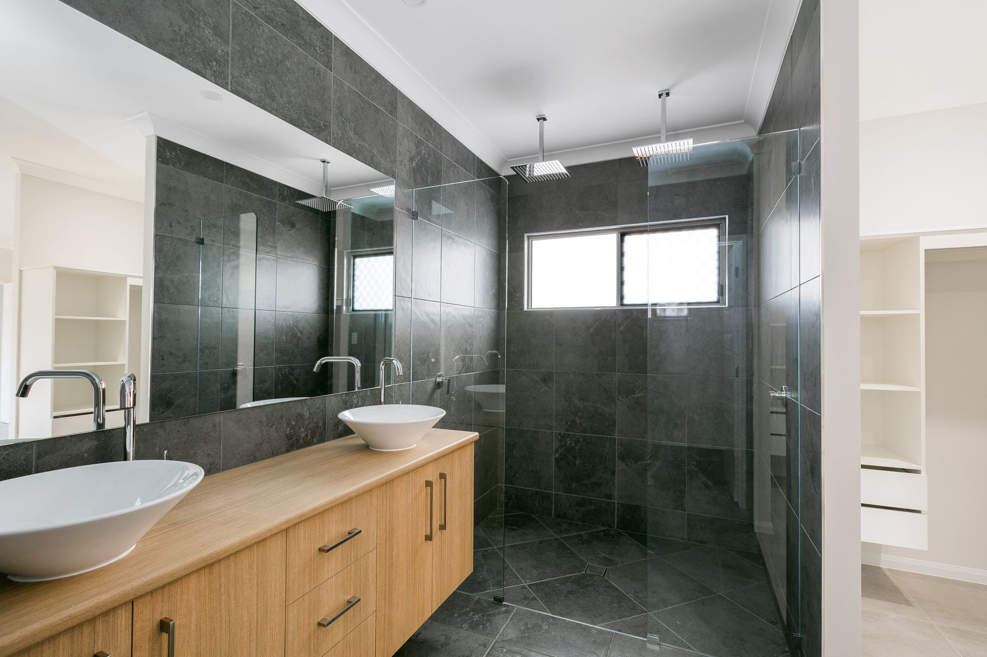 Modern Bathroom With Light Wood Vanity, White Vessel Sinks — Ashlee Jones Homes in Gordonvale, QLD
