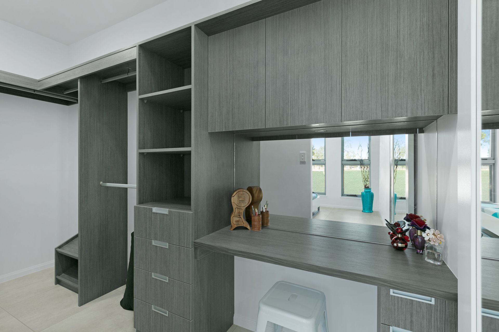 Modern Grey Wood-grain Closet Featuring Shelving — Ashlee Jones Homes in Gordonvale, QLD