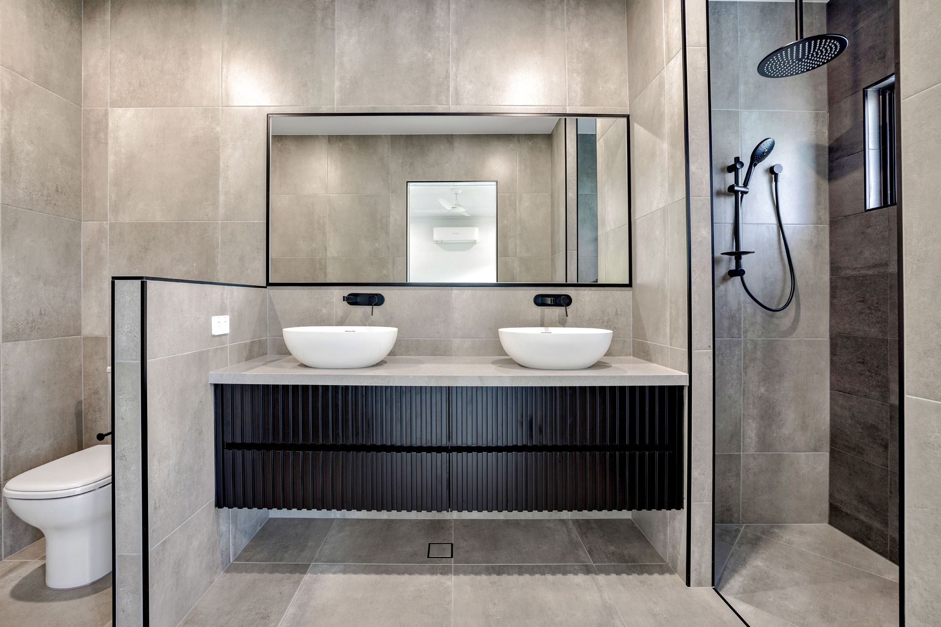 A Modern Bathroom With a Double-sink Vanity — Ashlee Jones Homes in Gordonvale, QLD
