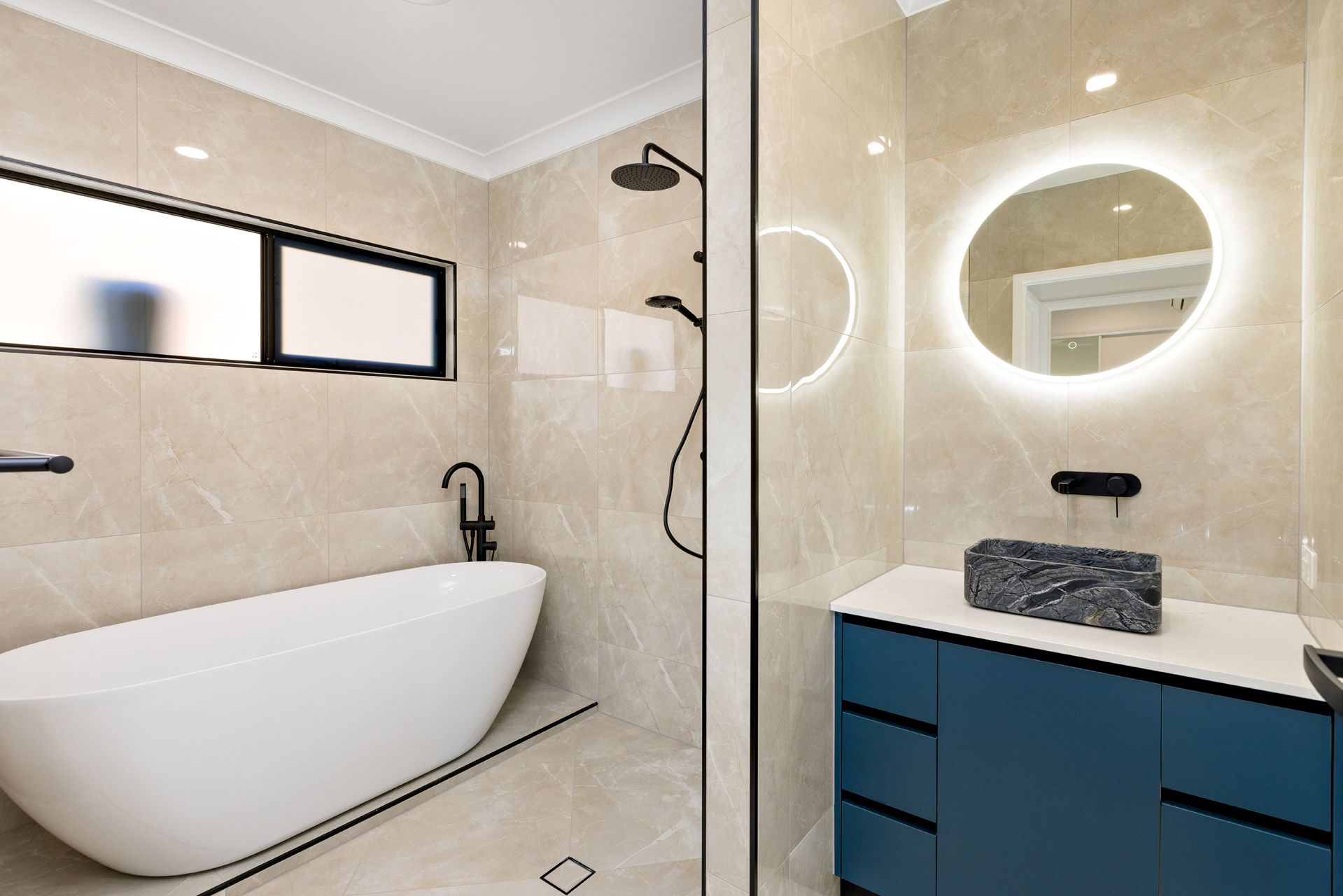 Modern Bathroom With a Freestanding White Tub — Ashlee Jones Homes in Gordonvale, QLD
