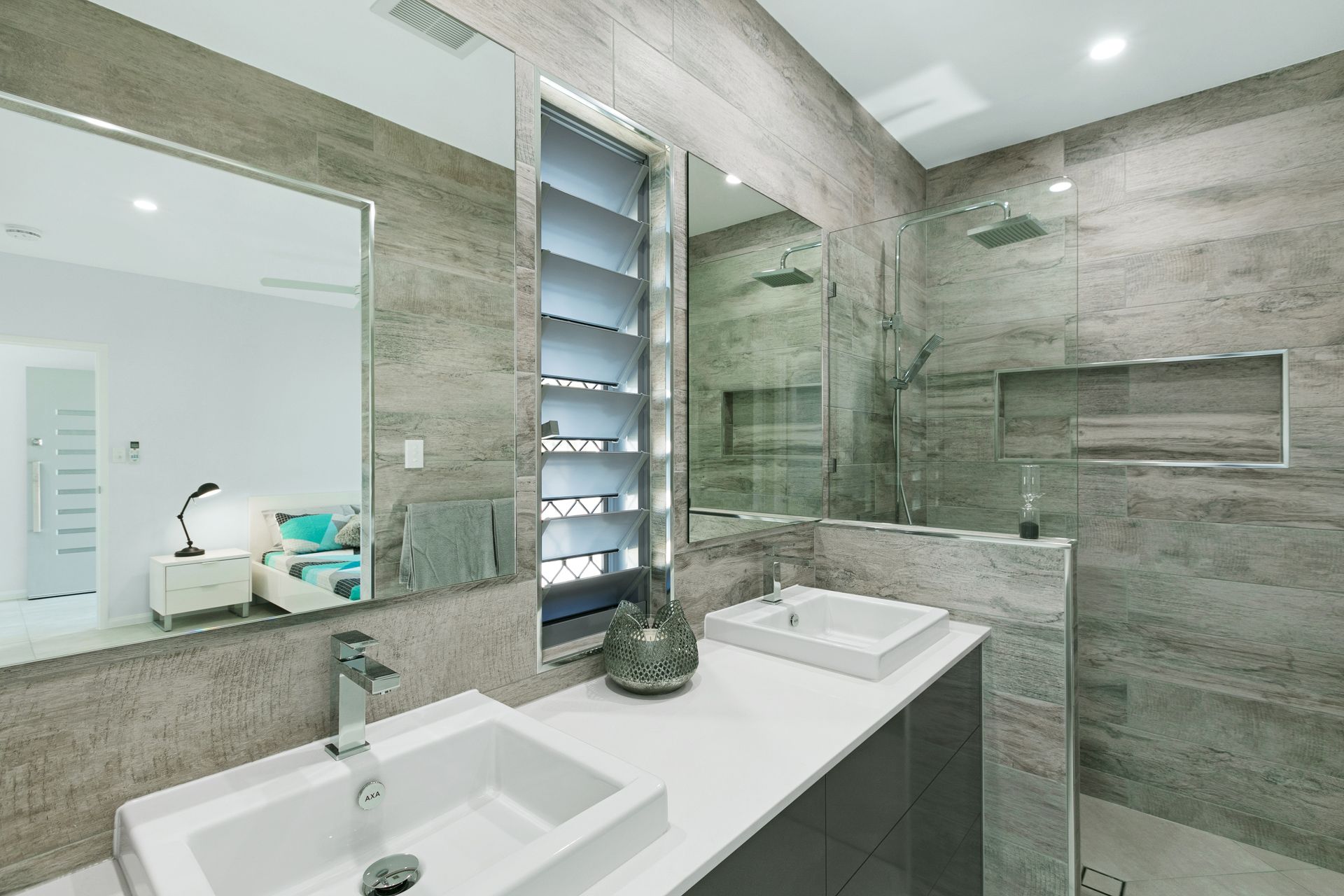 A Modern Bathroom Featuring Dual Sinks, Grey Tiled Walls — Ashlee Jones Homes in Gordonvale, QLD