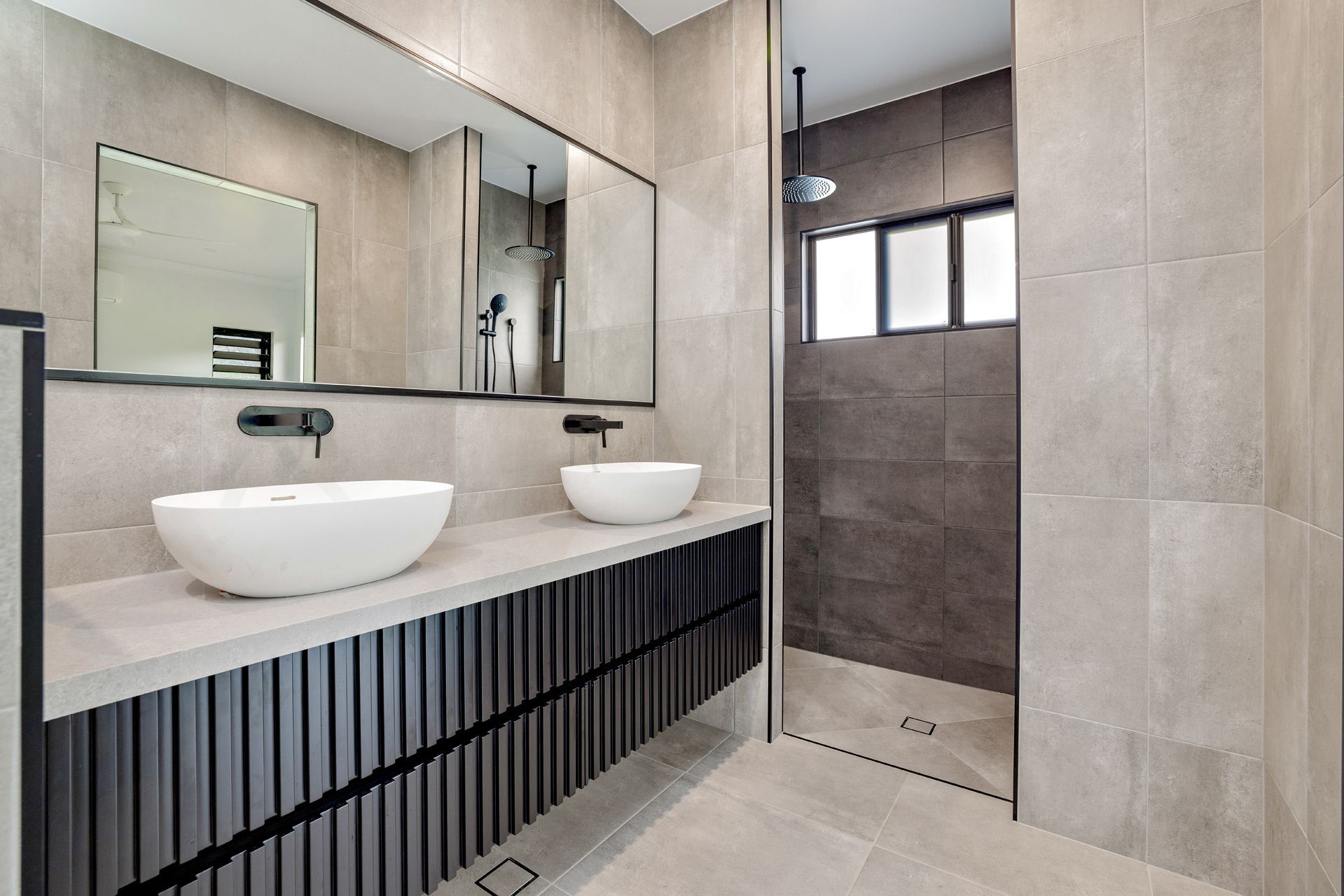 A Modern Bathroom With a Double Vanity, White Vessel Sinks — Ashlee Jones Homes in Gordonvale, QLD
