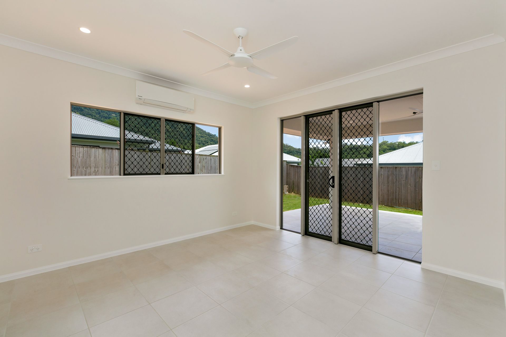 An Empty, Light-colored Room With White Walls — Ashlee Jones Homes in Gordonvale, QLD