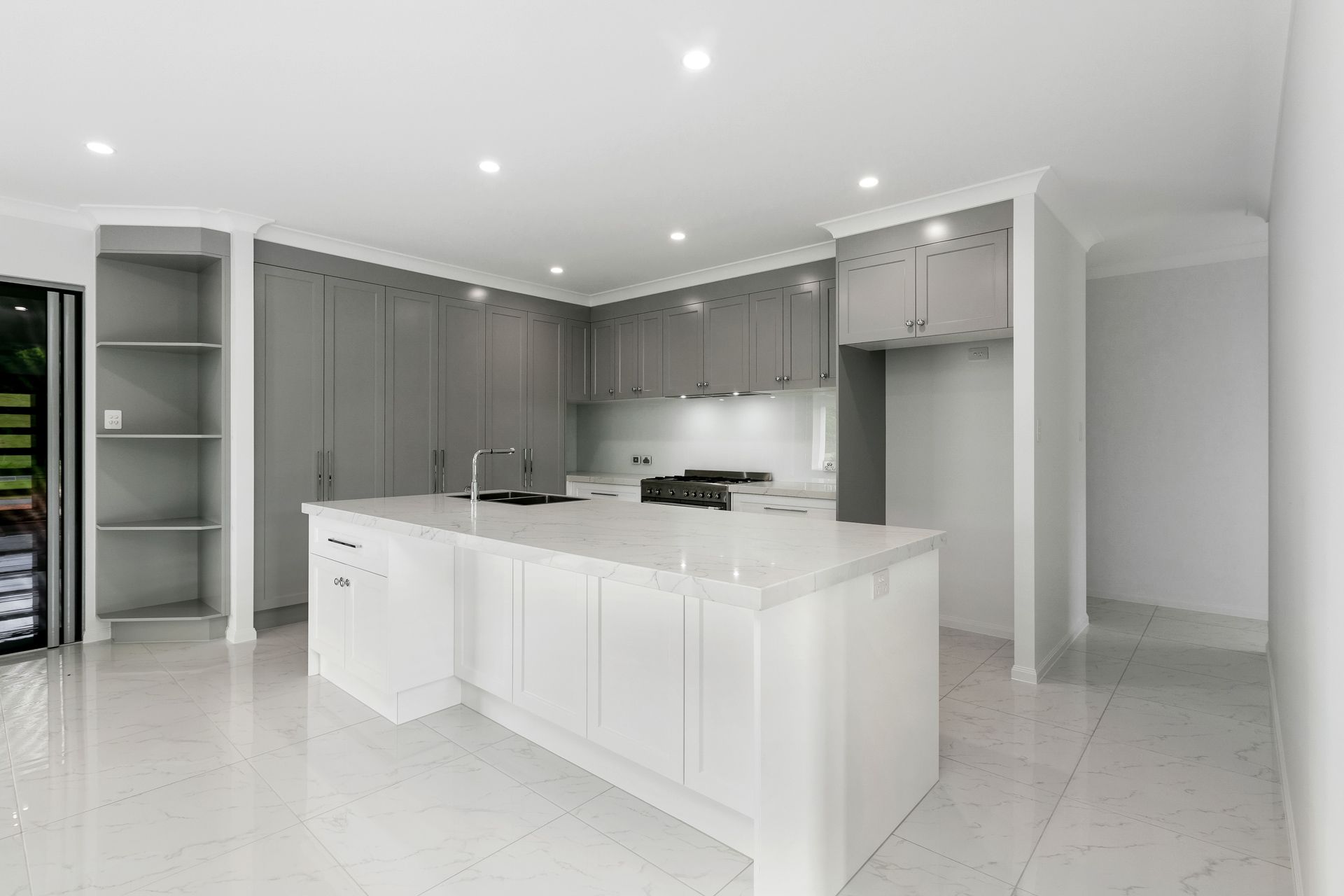A Modern Kitchen Featuring Grey Cabinets — Ashlee Jones Homes in Gordonvale, QLD