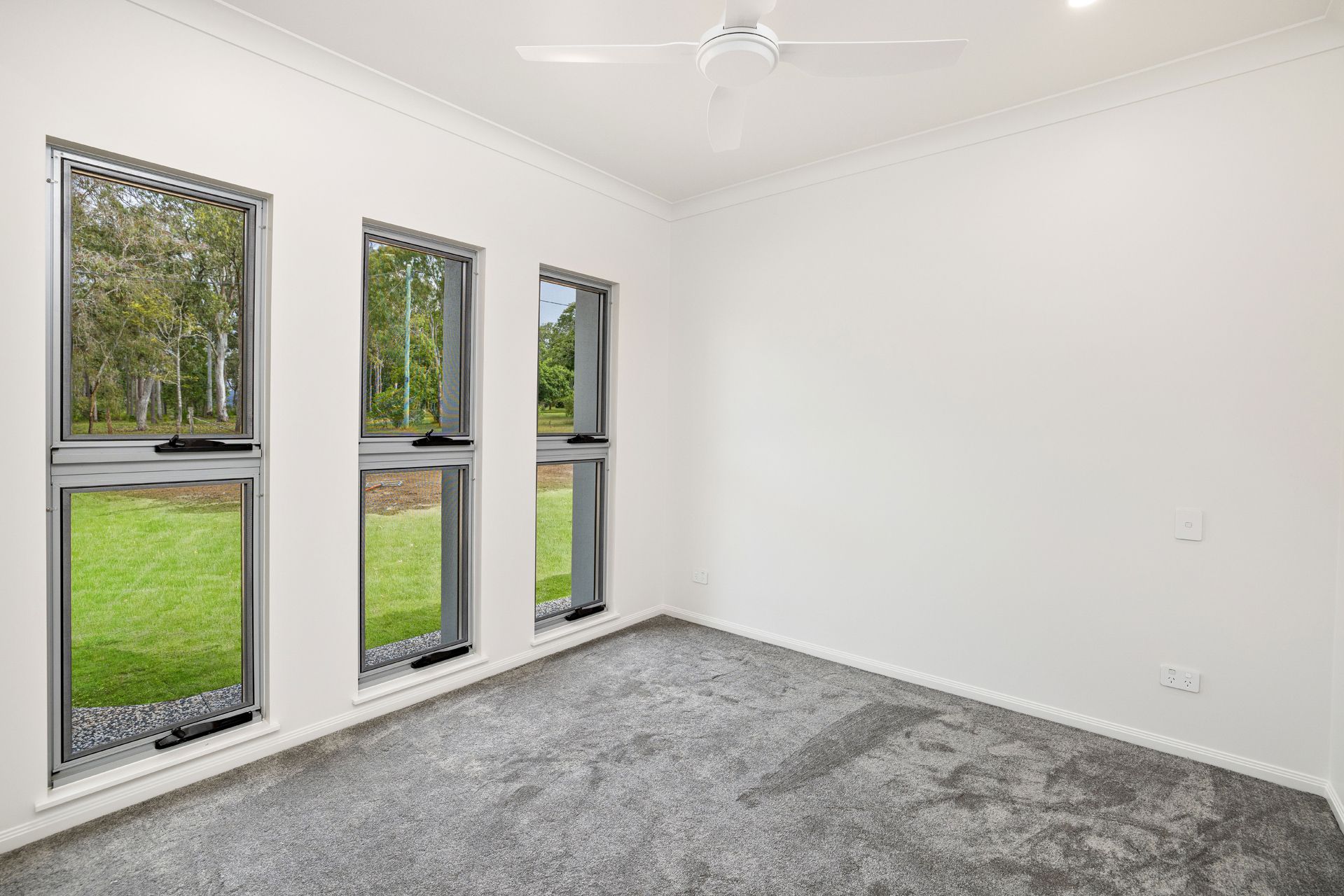 An Empty Room With White Walls — Ashlee Jones Homes in Gordonvale, QLD