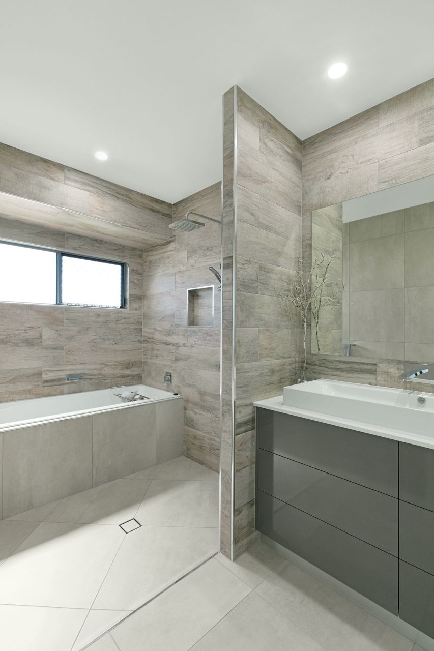 Modern Bathroom Featuring a Gray Vanity — Ashlee Jones Homes in Gordonvale, QLD