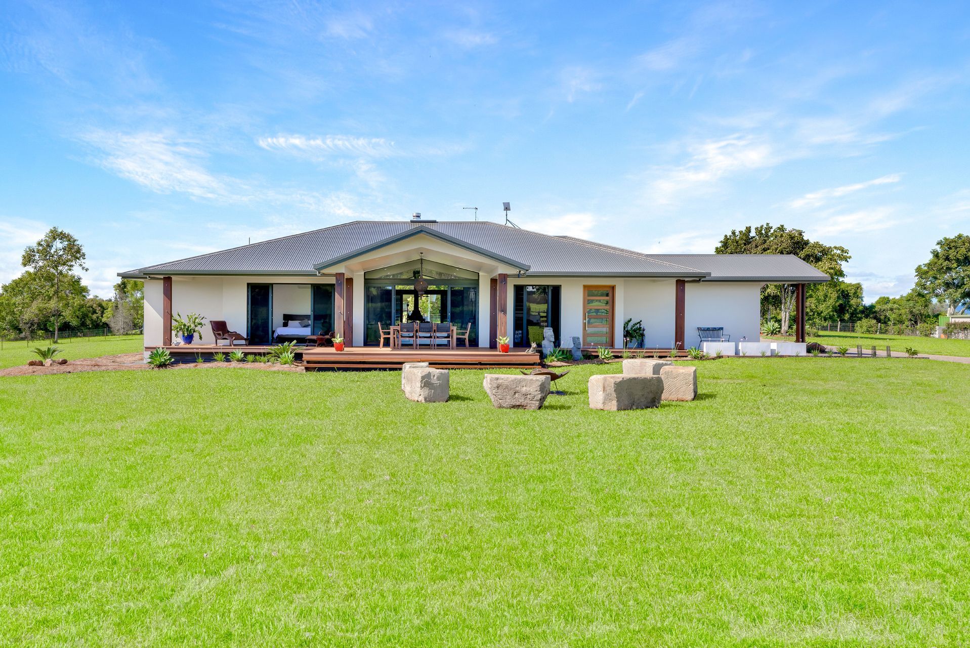A Single-story, White House With a Dark Gray Gabled Roof — Ashlee Jones Homes in Gordonvale, QLD