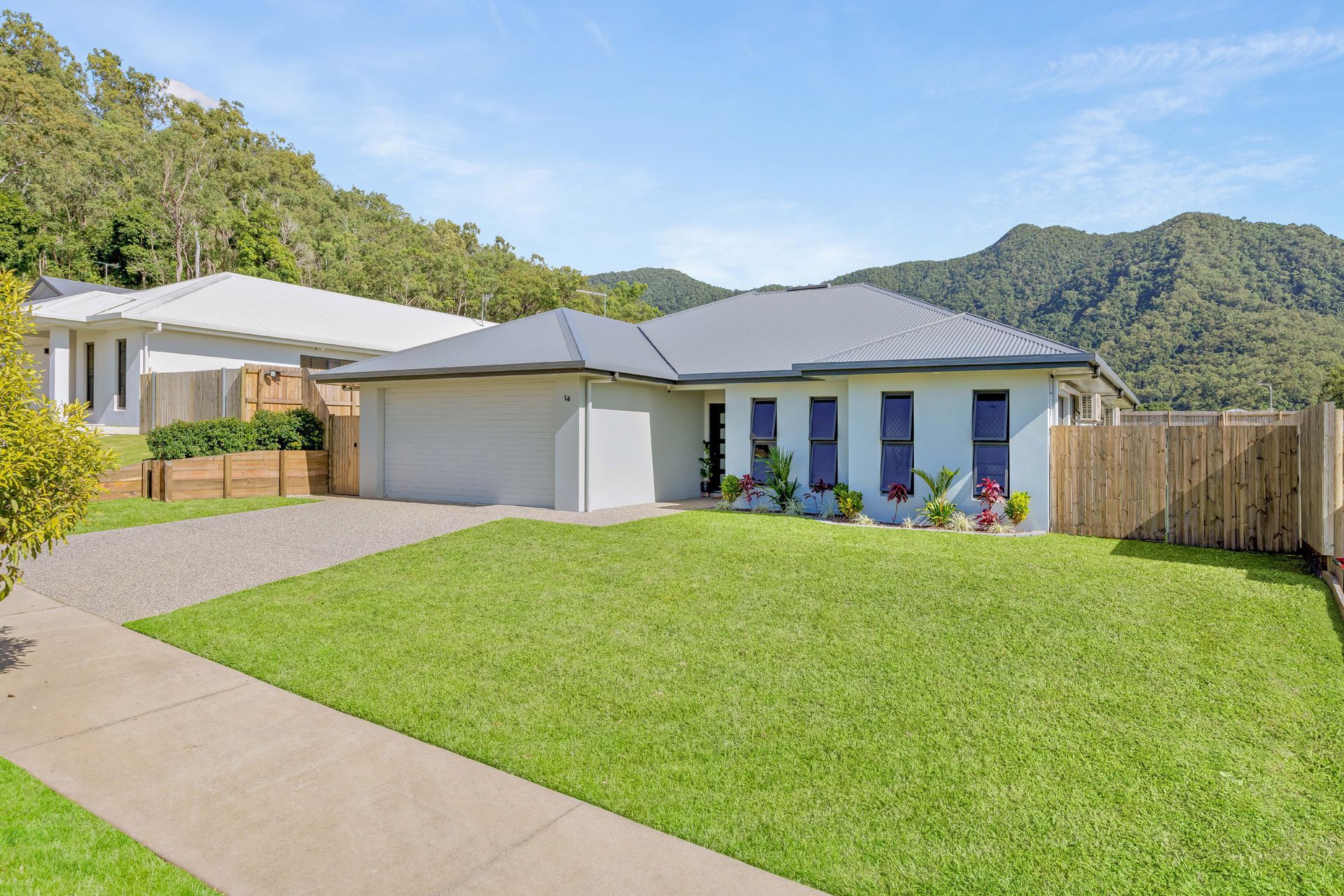 Single-story Suburban House With a Gray Roof and White Exterior — Ashlee Jones Homes in Gordonvale, QLD