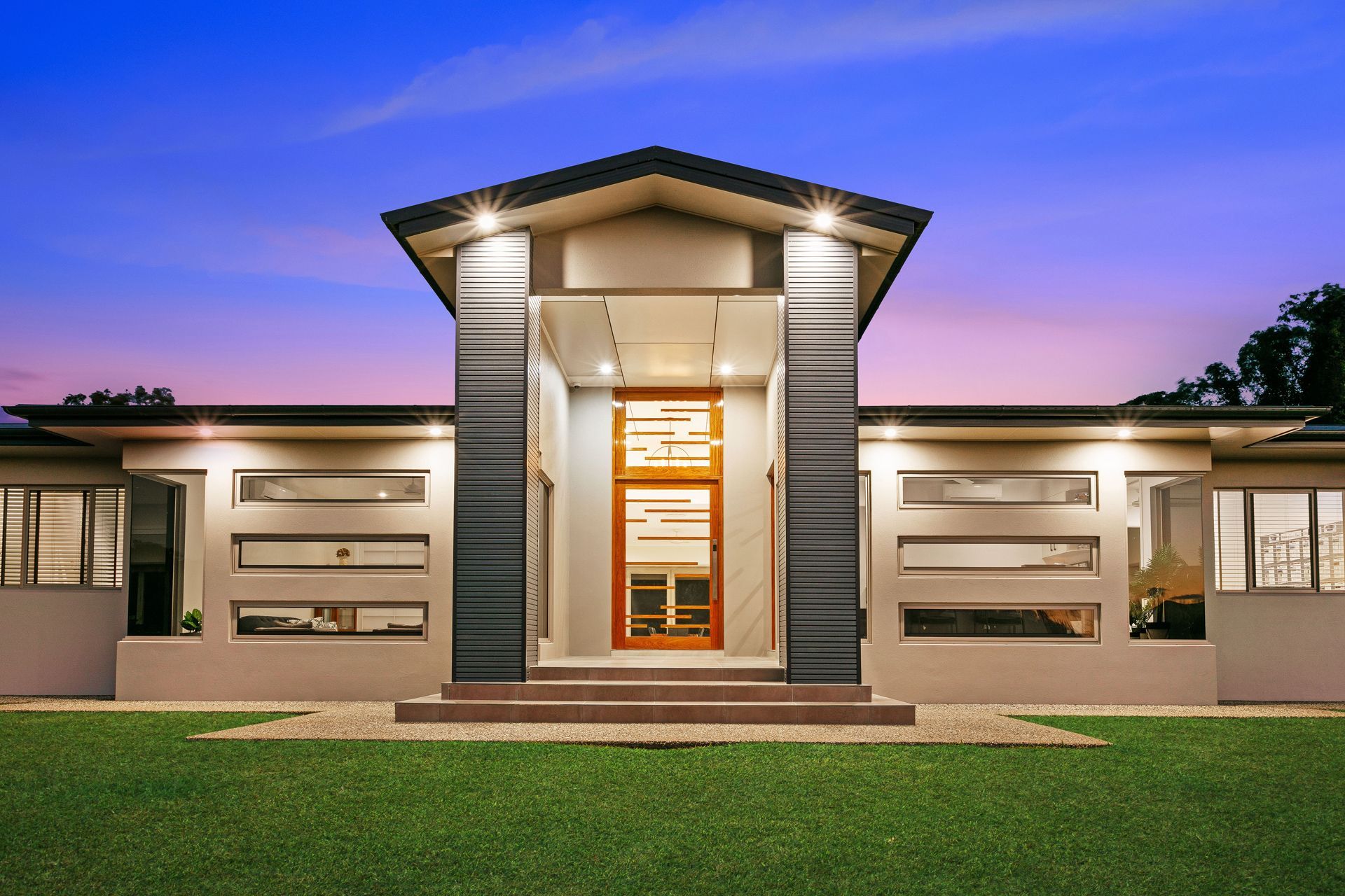 A Modern, Single-story House With a Central Elevated Entryway — Ashlee Jones Homes in Gordonvale, QLD