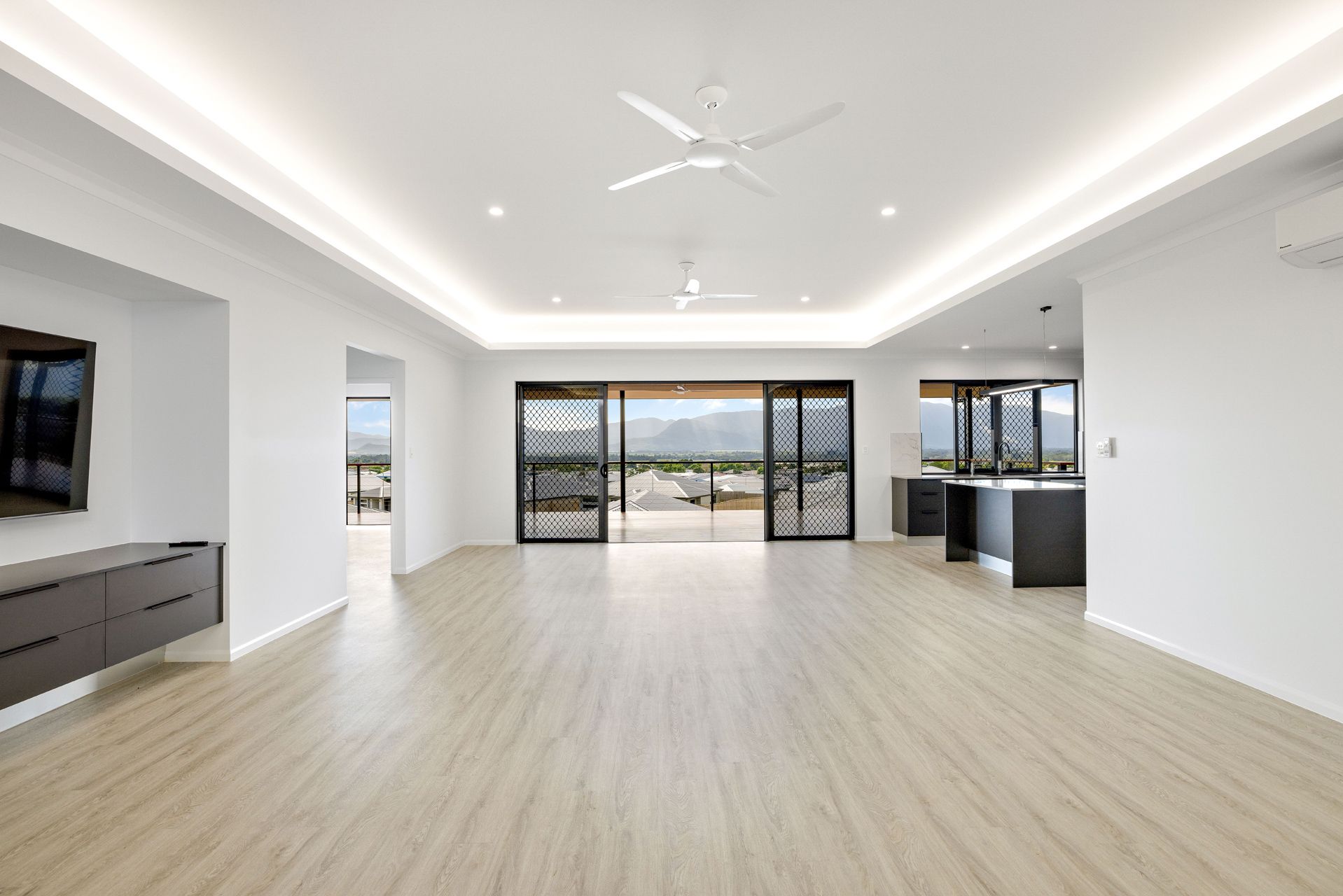 Spacious Modern Living Area With White Walls — Ashlee Jones Homes in Gordonvale, QLD