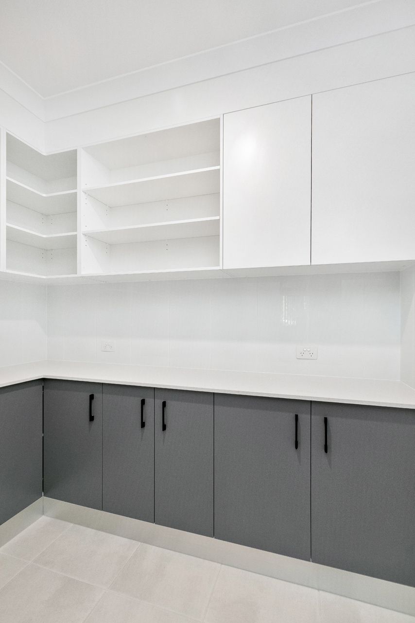 Modern Kitchen Featuring White Open Shelving — Ashlee Jones Homes in Gordonvale, QLD