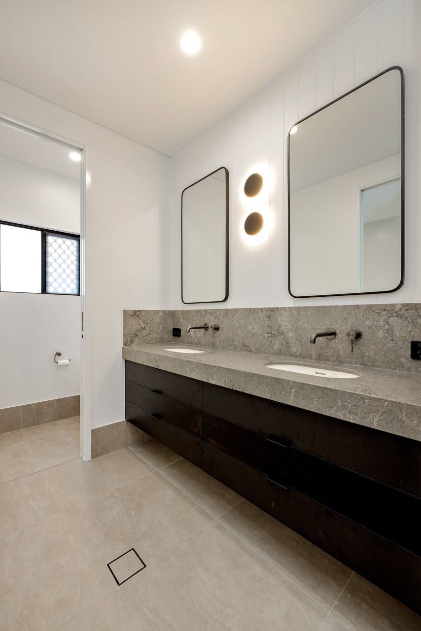 Modern Bathroom With a Long, Stone Double Vanity — Ashlee Jones Homes in Gordonvale, QLD