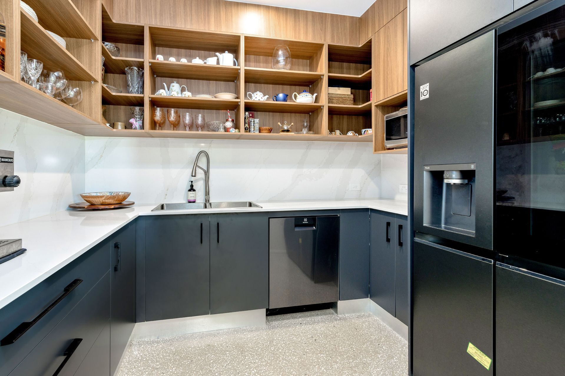 Modern Kitchen With Open Wood Shelving, Dark Gray Cabinets — Ashlee Jones Homes in Gordonvale, QLD