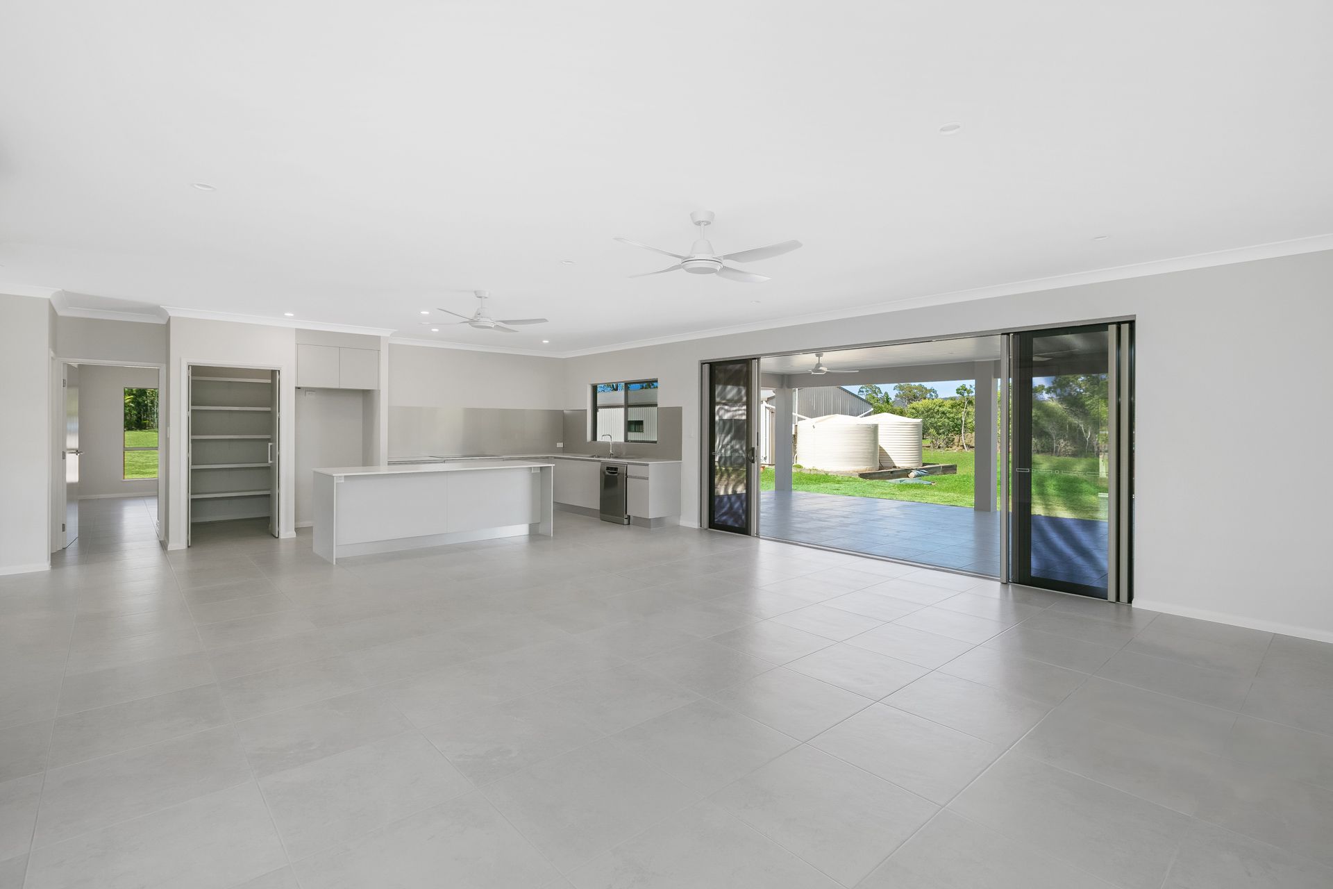 A Modern, Open-plan Kitchen and Living Space — Ashlee Jones Homes in Gordonvale, QLD