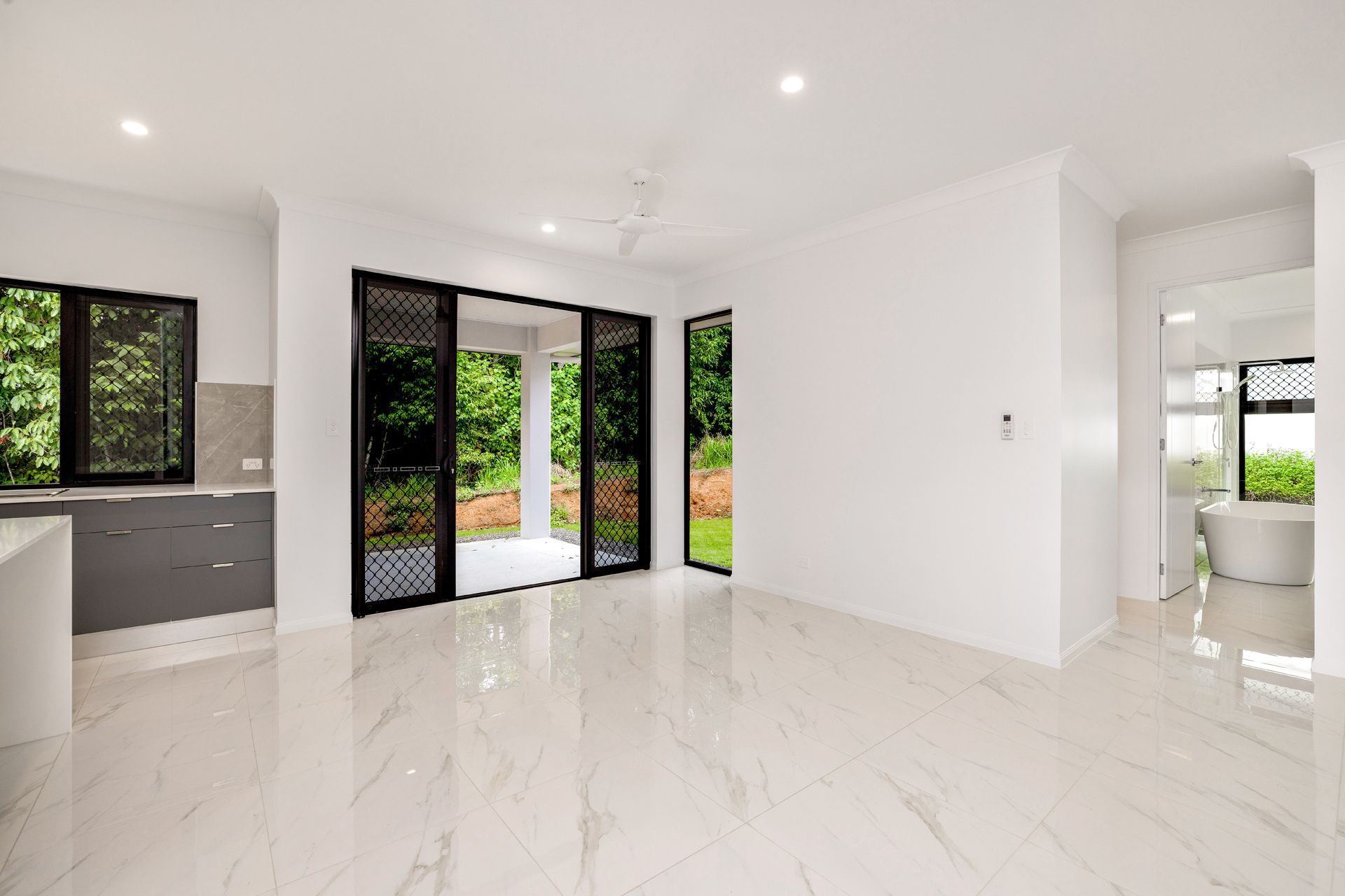 A Modern, Minimalist Room With White Walls — Ashlee Jones Homes in Gordonvale, QLD