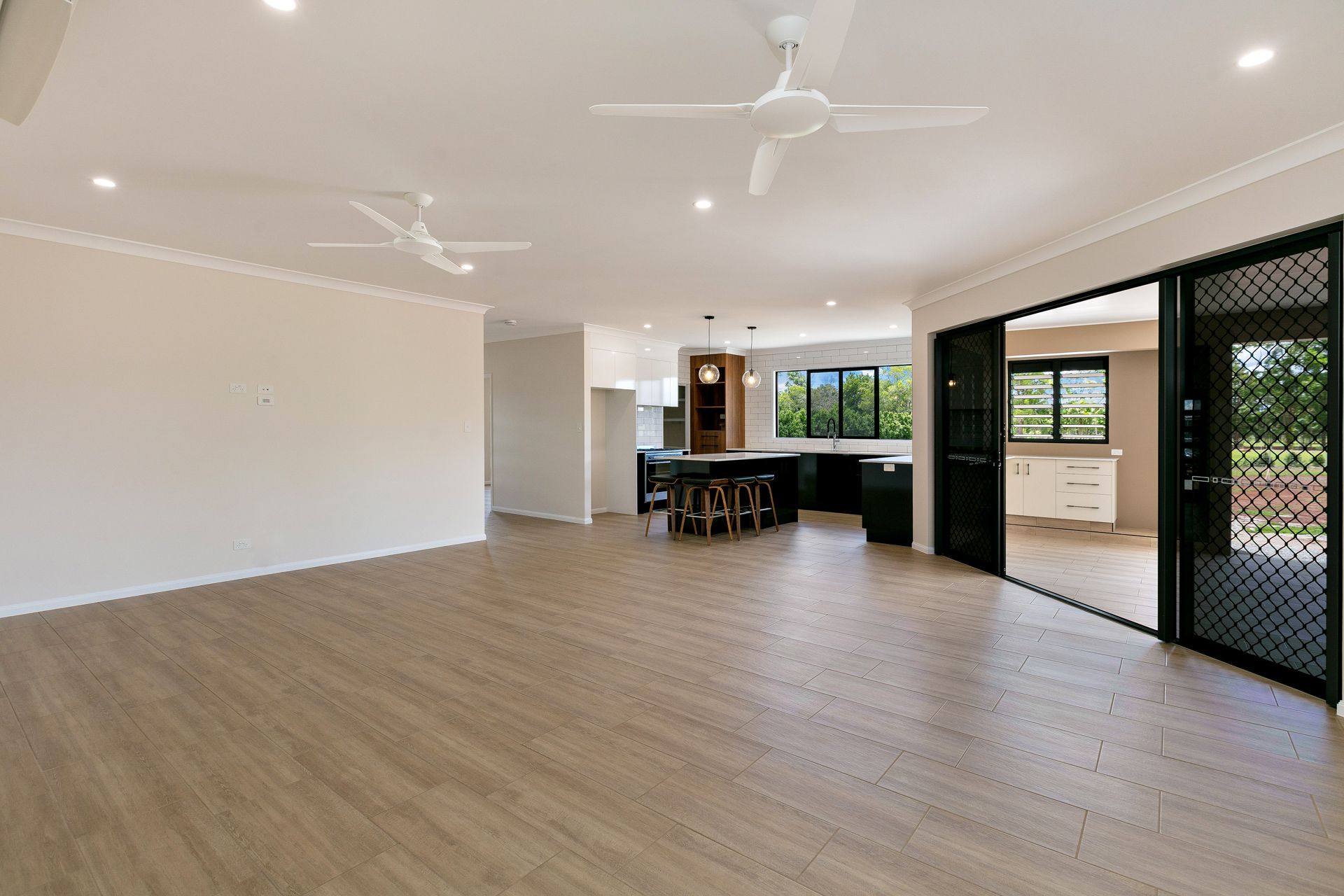 Wide-angle View of a Bright, Open-plan Living Room — Ashlee Jones Homes in Gordonvale, QLD