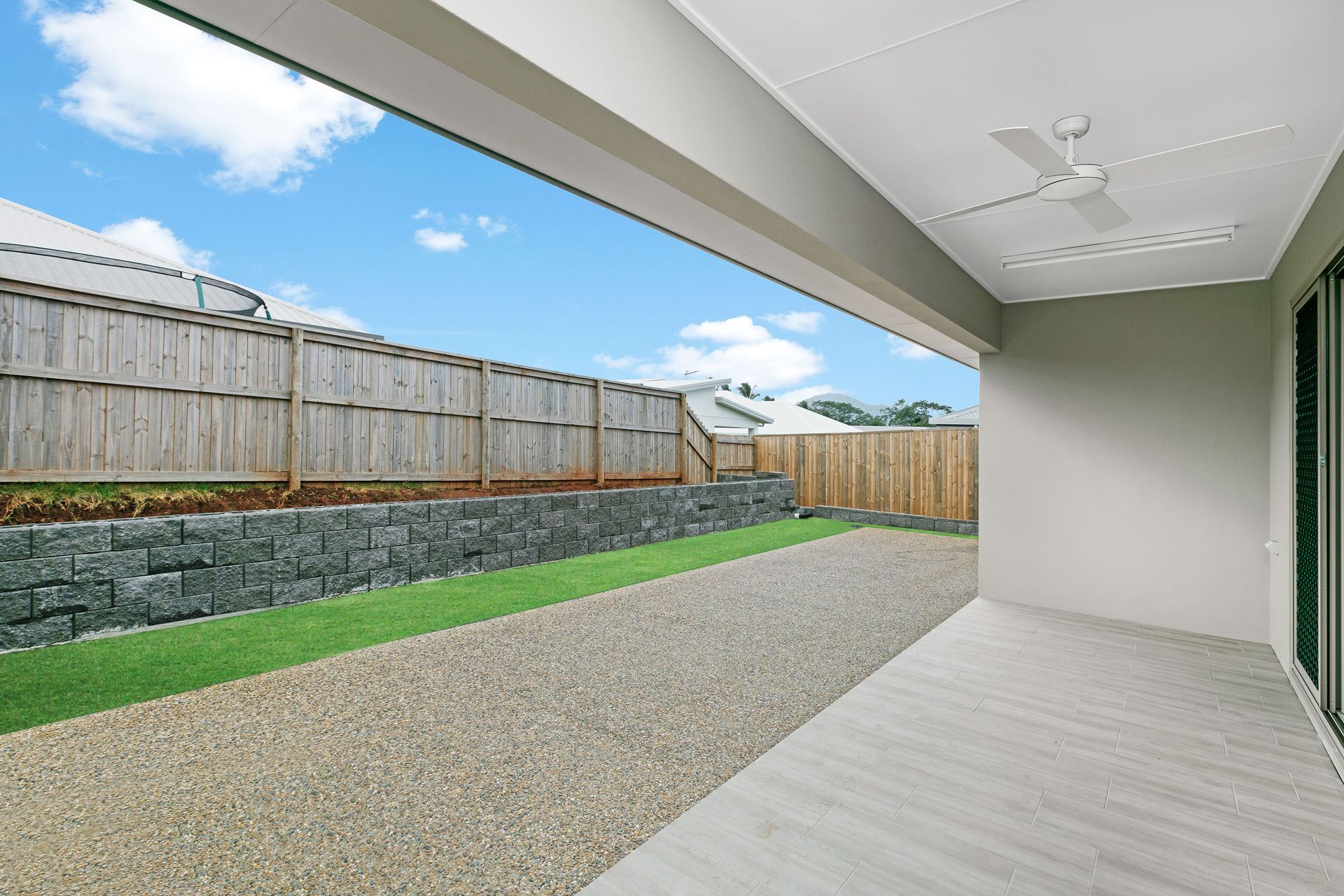 A Covered Patio With Light-colored Flooring — Ashlee Jones Homes in Gordonvale, QLD