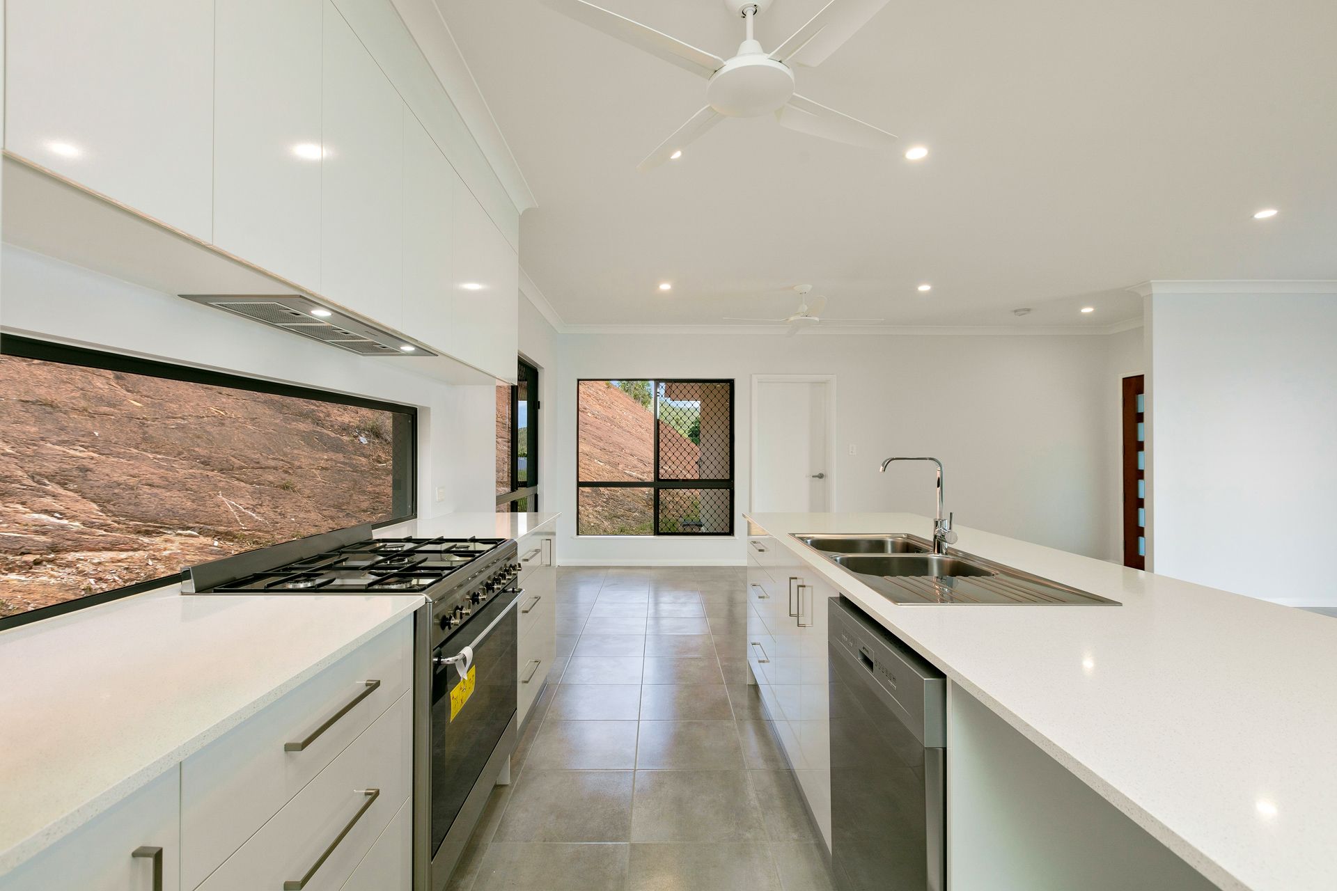 Modern Kitchen With White Cabinetry, Quartz Countertops — Ashlee Jones Homes in Gordonvale, QLD