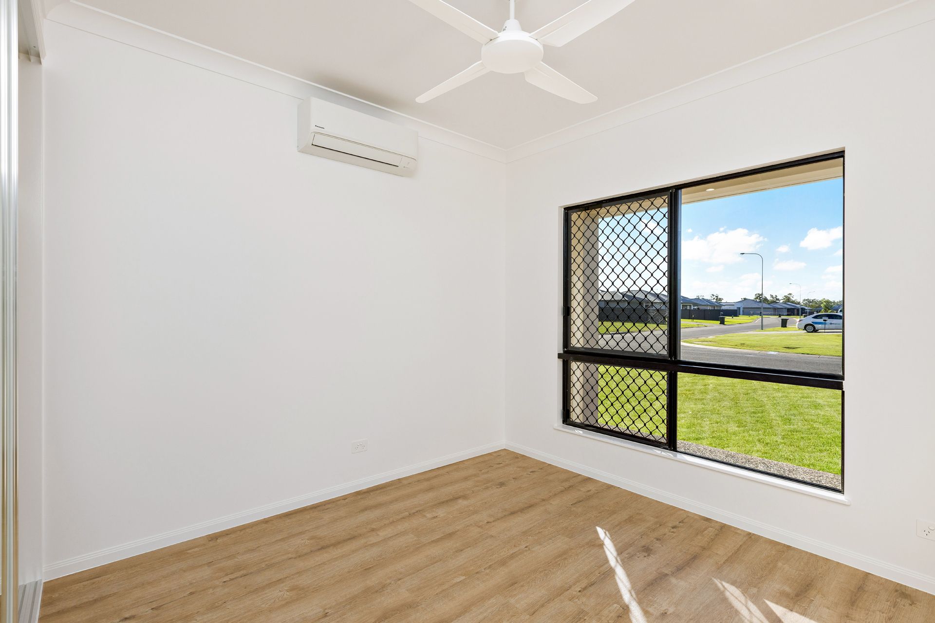 An Empty, Brightly Lit Room With White Walls — Ashlee Jones Homes in Gordonvale, QLD