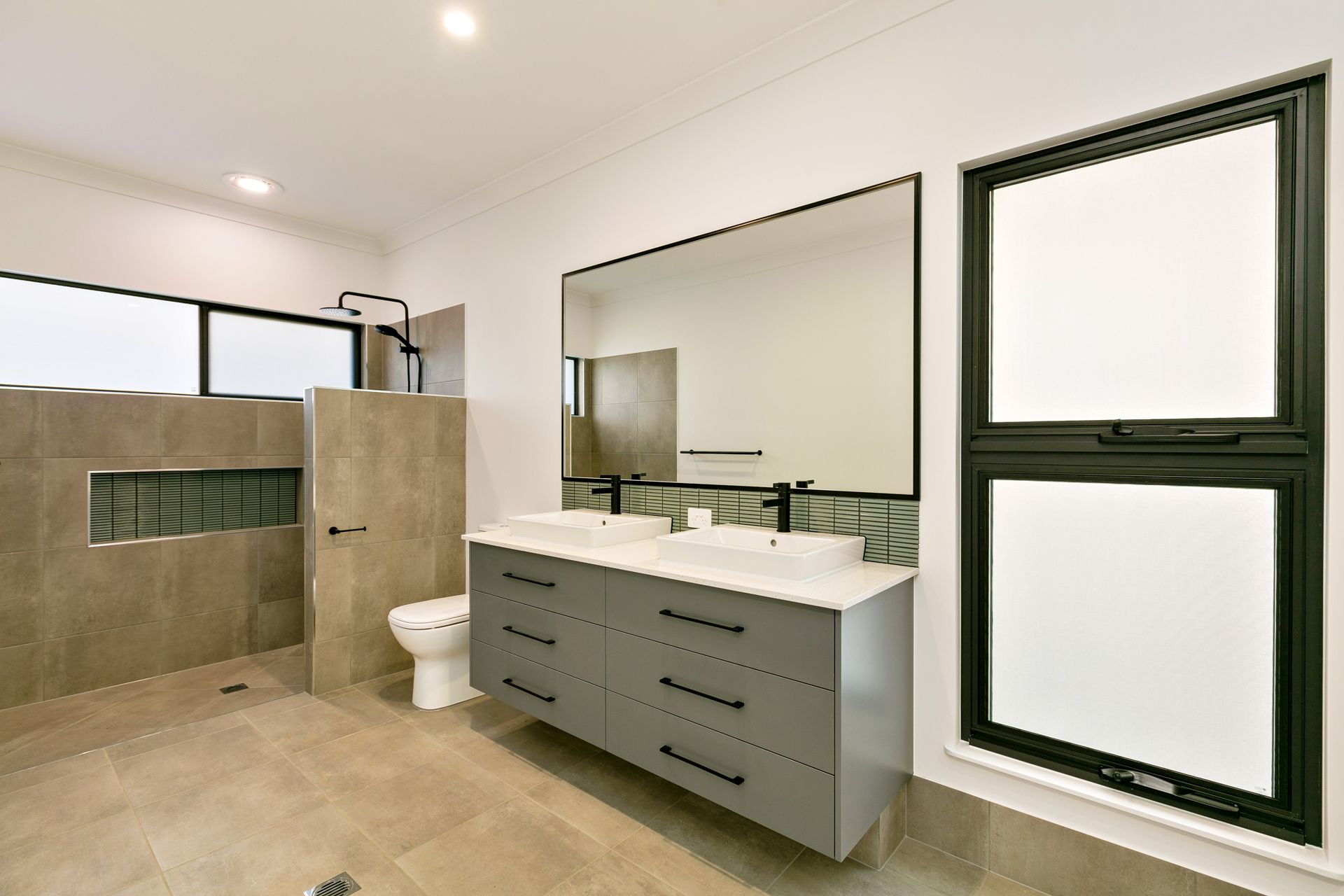 Modern Bathroom With a Double Sink Gray Vanity — Ashlee Jones Homes in Gordonvale, QLD